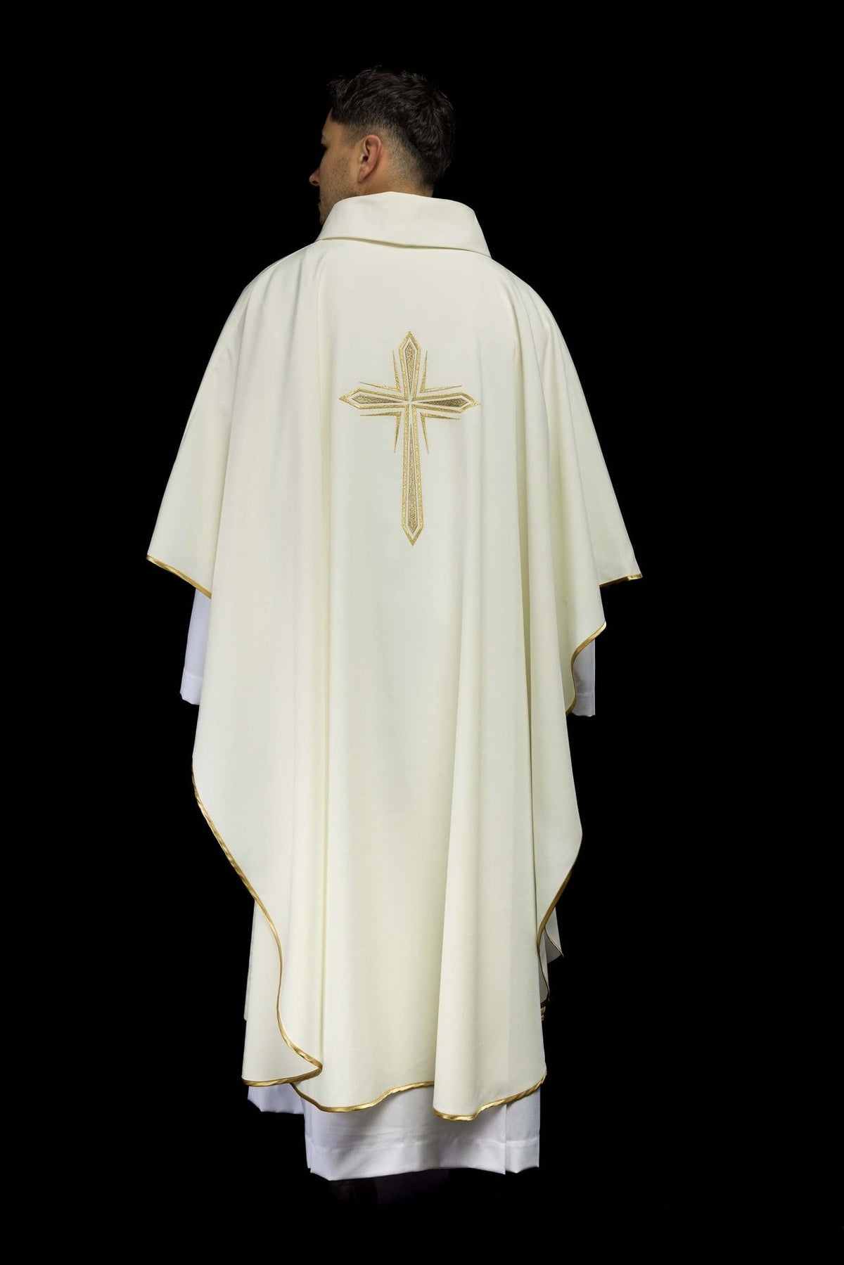 Ivory chasuble back view with centered gold cross embroidery and trim