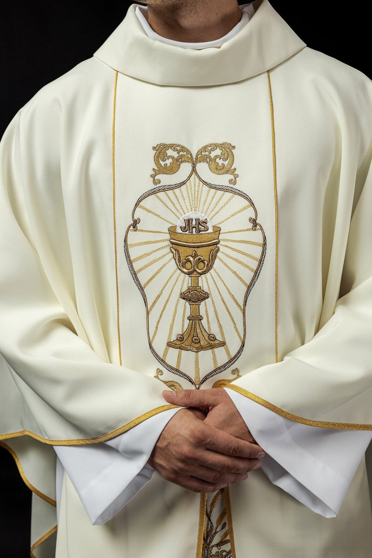 Ecru chasuble close-up showing stand-up collar and chalice embroidery