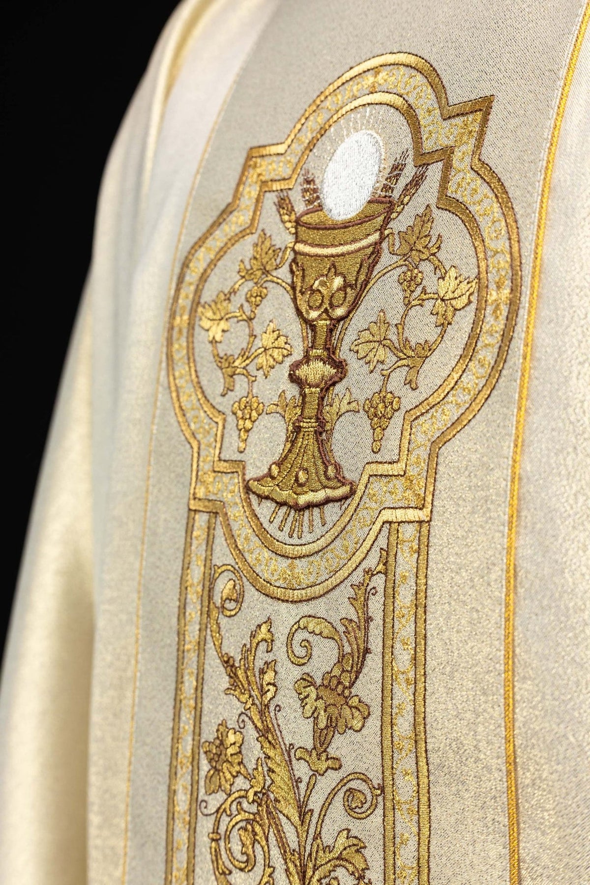 Gold chasuble close-up of chalice embroidery with gold edging