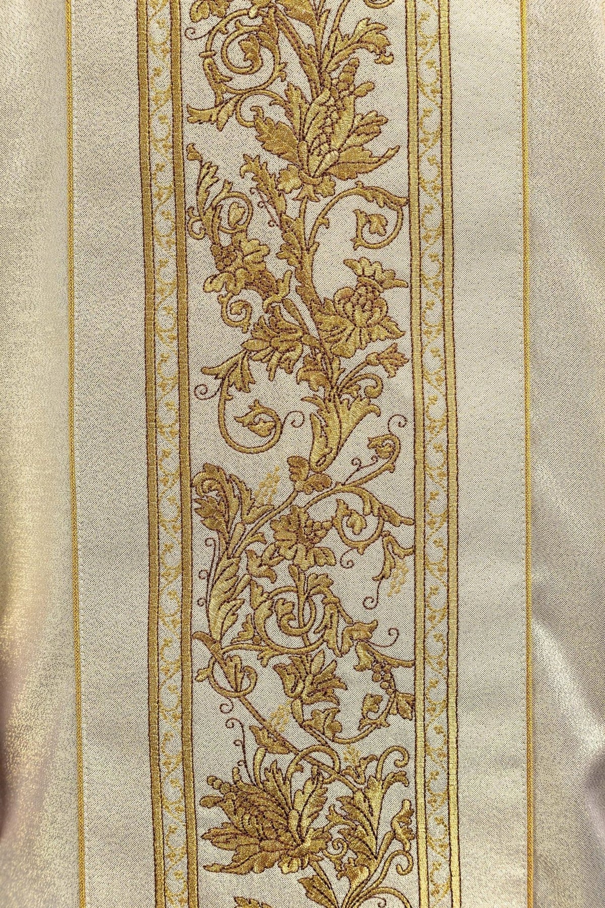Gold chasuble close-up of chalice and ornate floral embroidery