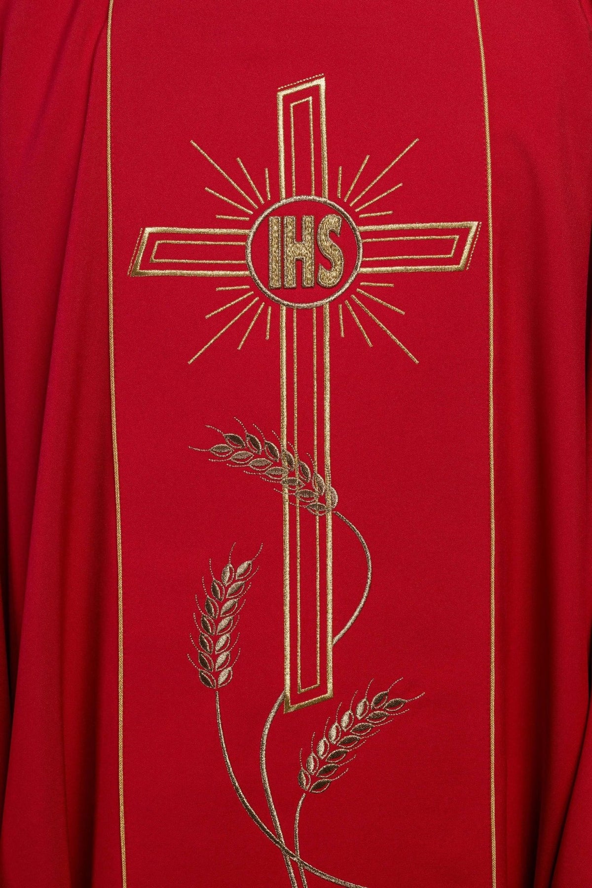 Red chasuble close-up of embroidered gold IHS cross and wheat motifs