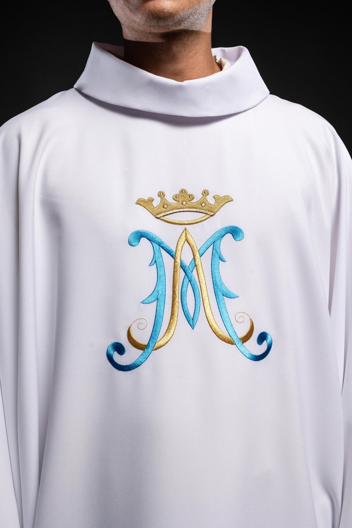 Marian chasuble close-up showing stand-up collar and crowned blue and gold Marian motif