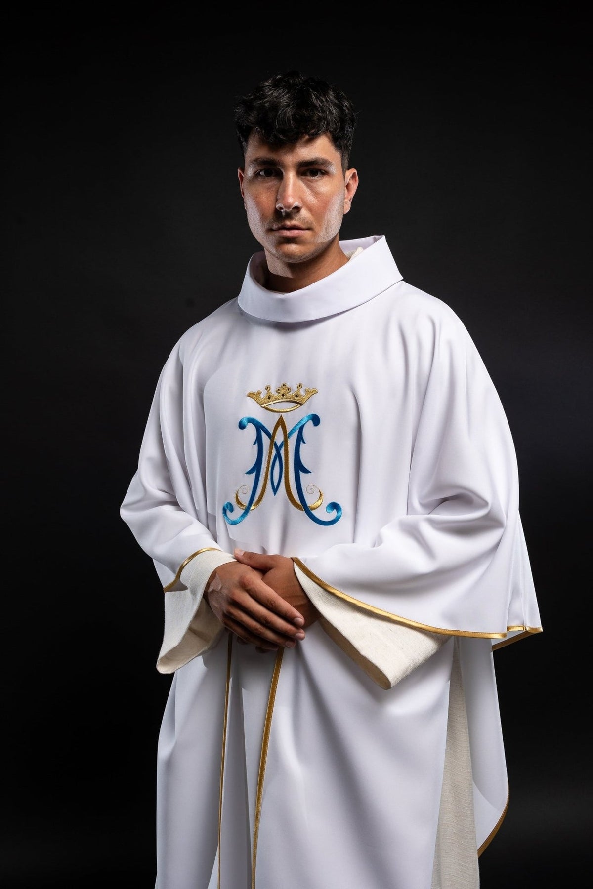 Marian chasuble, angled front view with gold trim and embroidered Marian motif