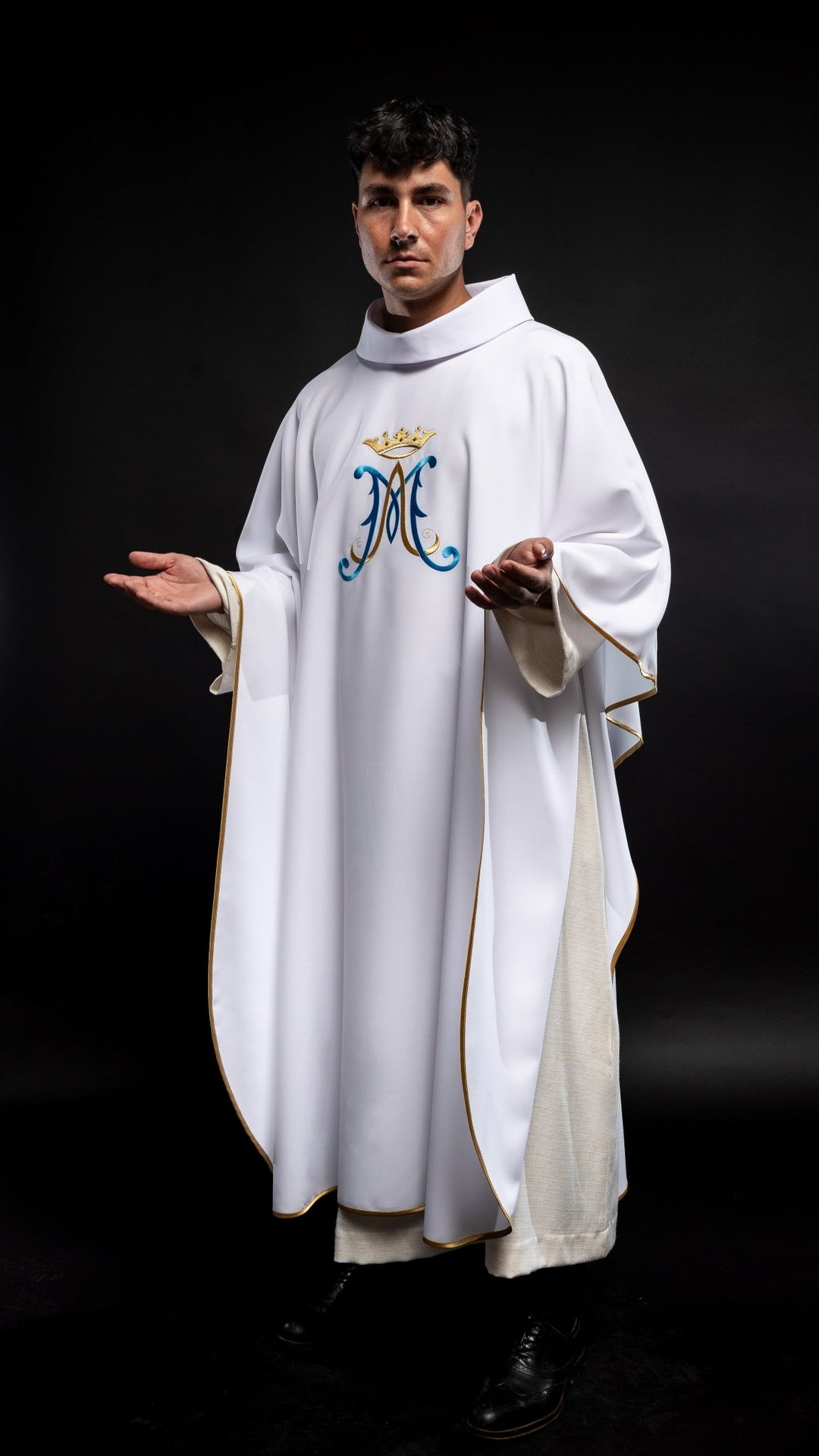 Marian chasuble, angled view showing wide sleeves, gold trim and embroidered Marian motif