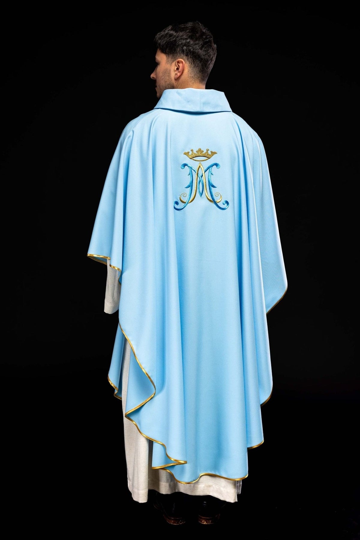 Blue chasuble back close-up showing gold and blue Marian motif embroidery