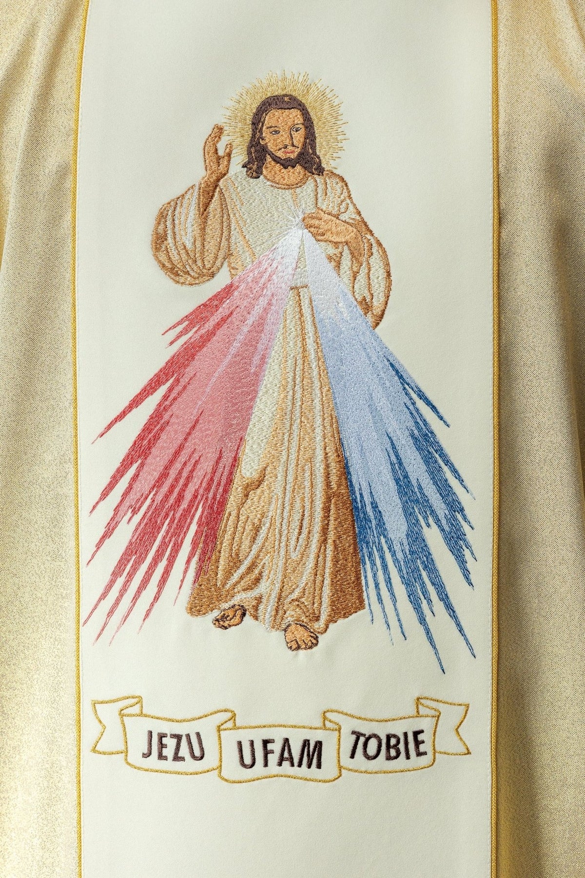 Gold chasuble close-up of Divine Mercy embroidery with red and blue rays