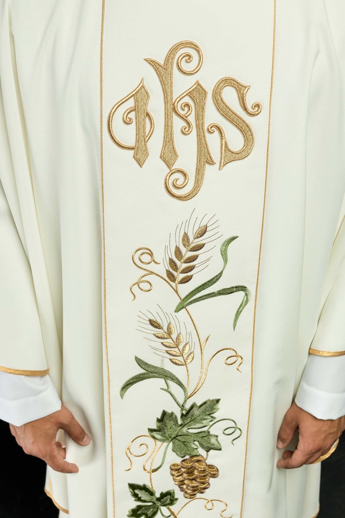 Ecru chasuble close-up of embroidered gold IHS symbol and wheat