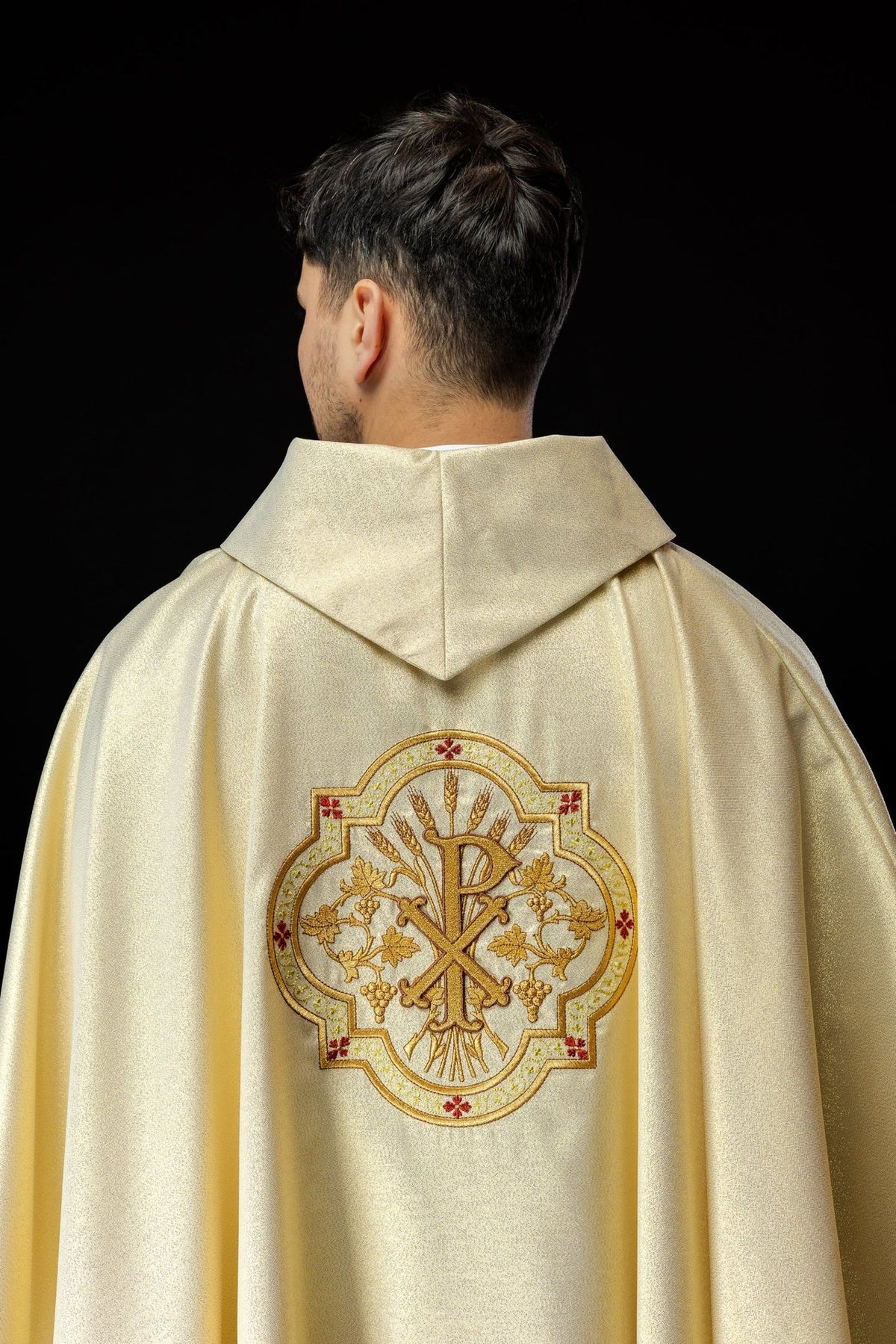 Gold chasuble back view with PAX embroidery, wheat, grapes and red accents