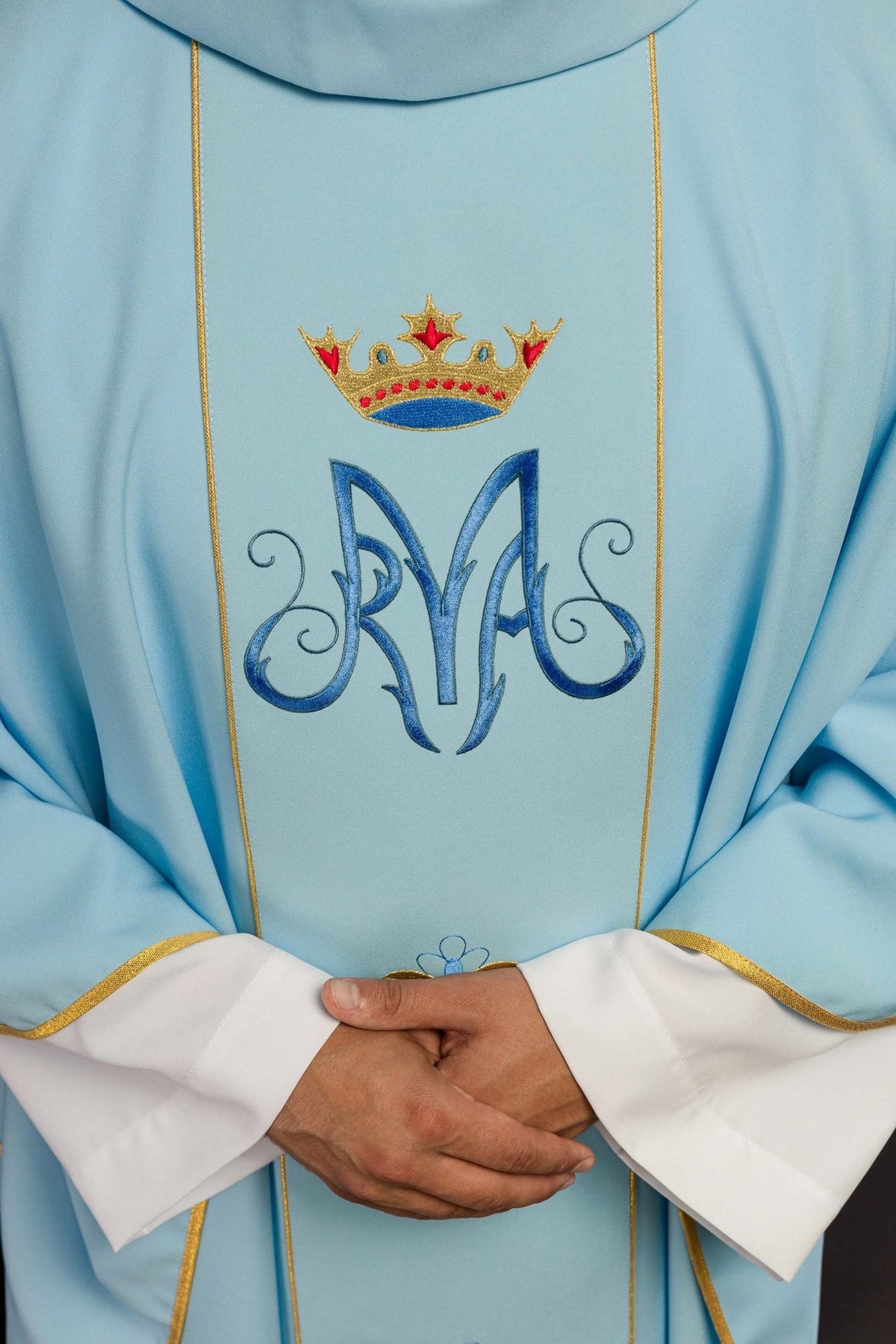 Blue chasuble orphrey close-up with Marian symbol and crown embroidery