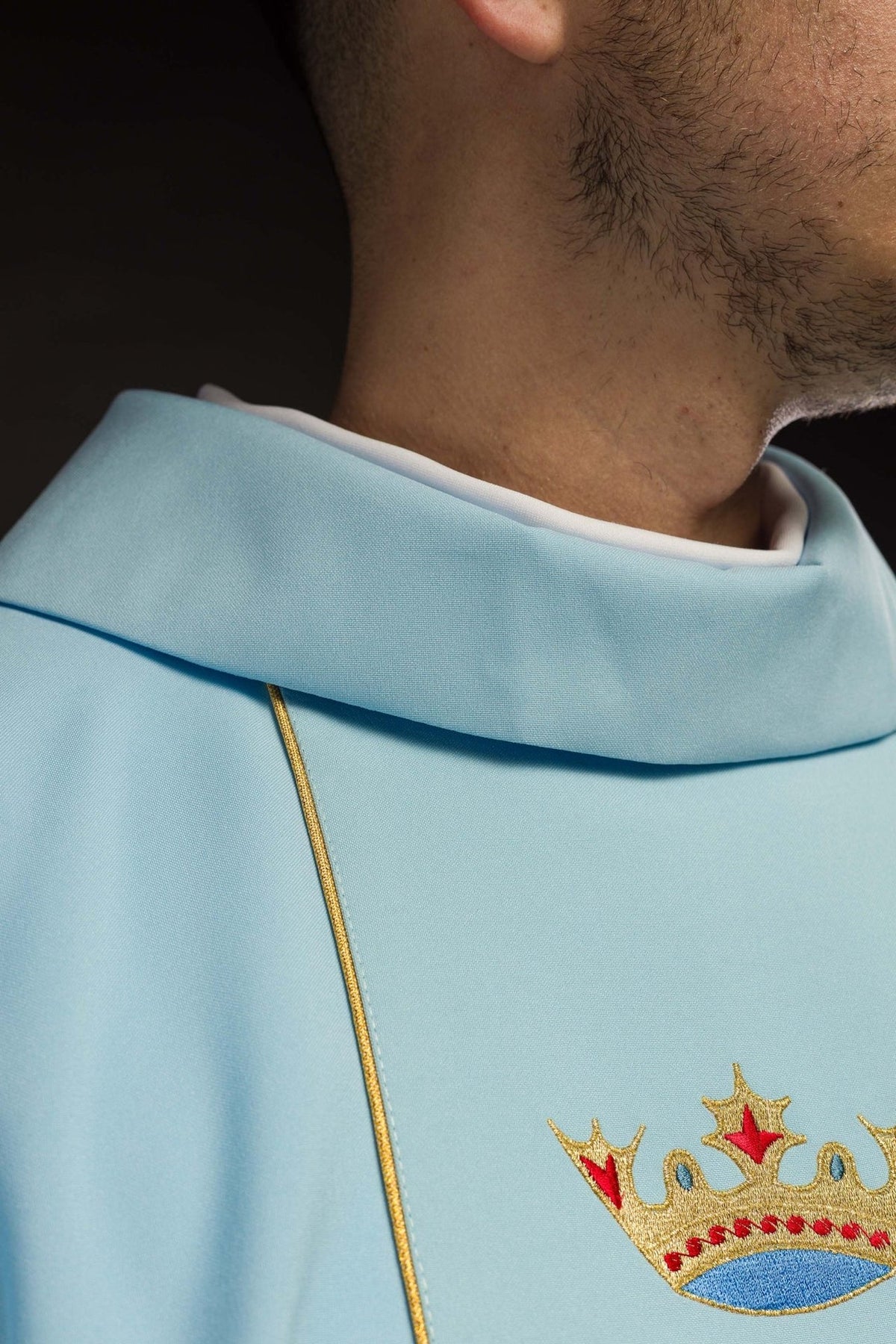 Blue chasuble stand-up collar and gold trim close-up