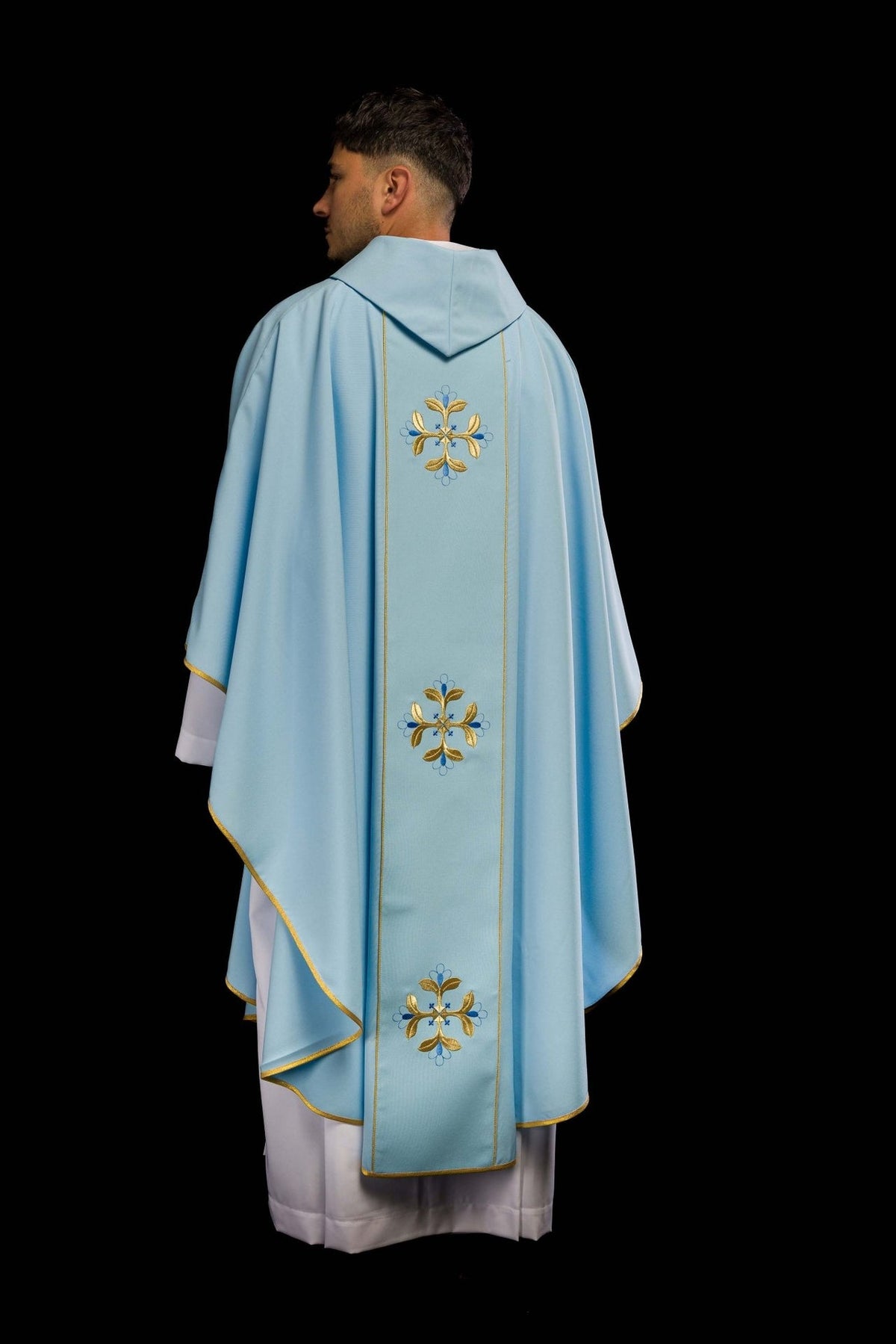 Blue chasuble back view with orphrey and repeated floral embroidery