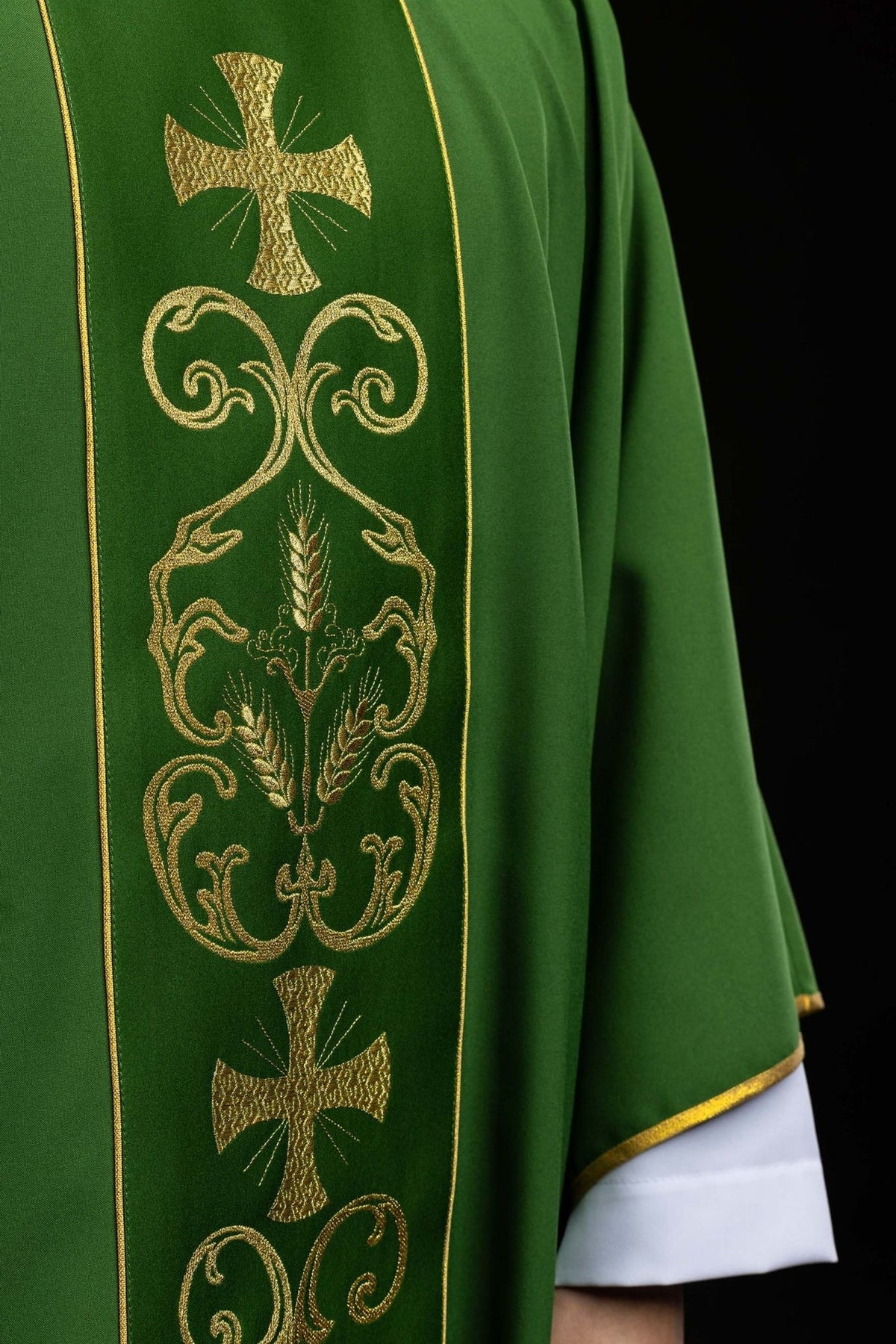 Green chasuble, close-up of gold cross, wheat embroidery and ornate orphrey