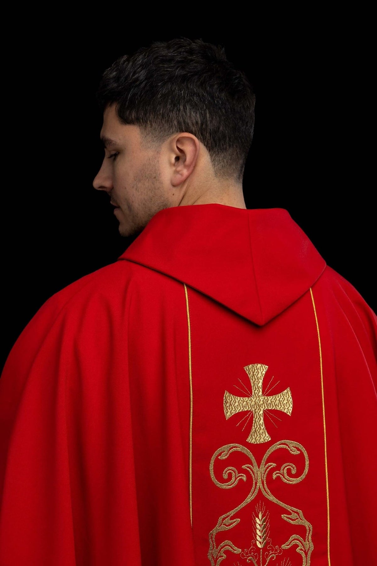 Red chasuble, back view with gold embroidered orphrey and cross motifs