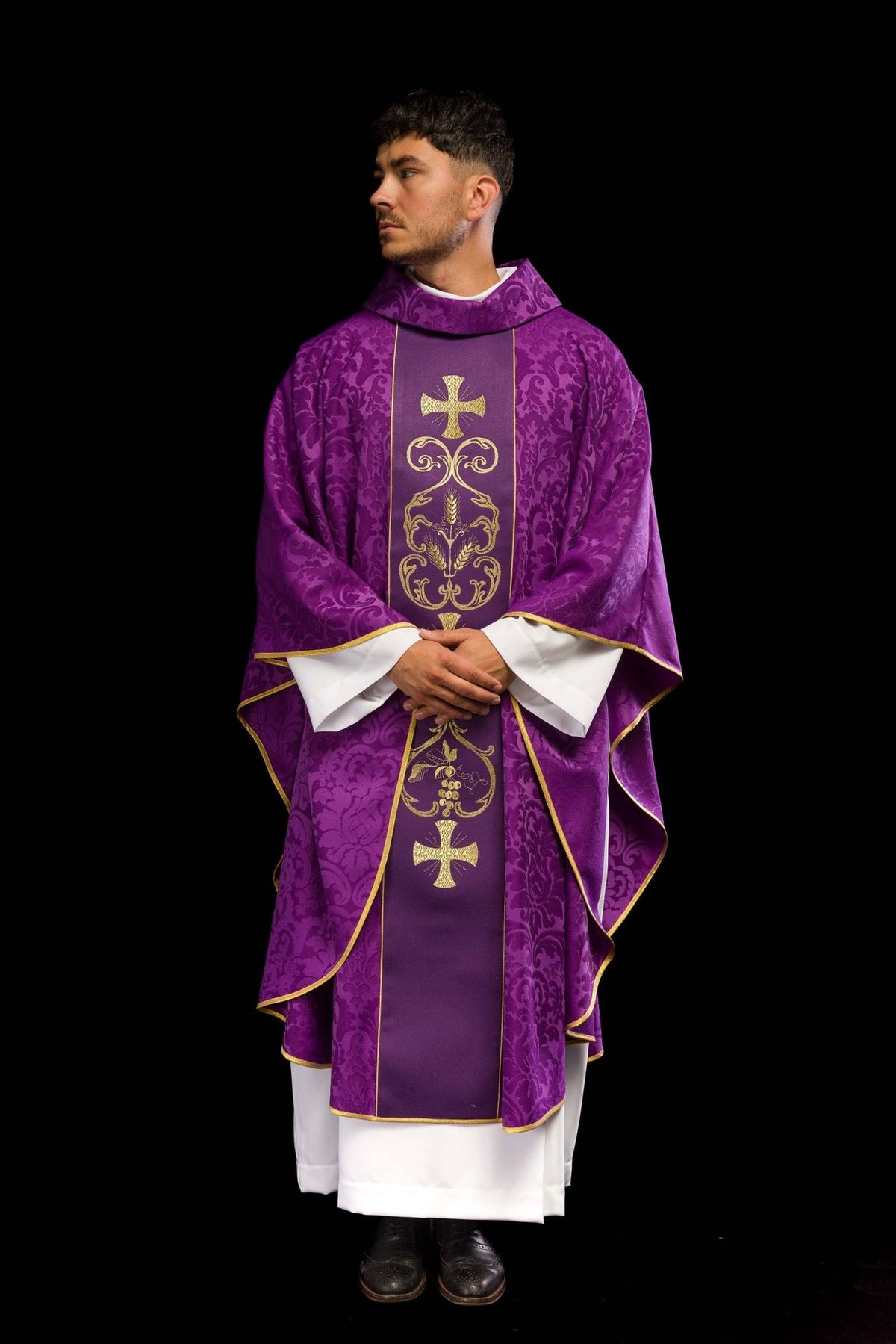 Purple chasuble front view with gold embroidered orphrey and patterned fabric