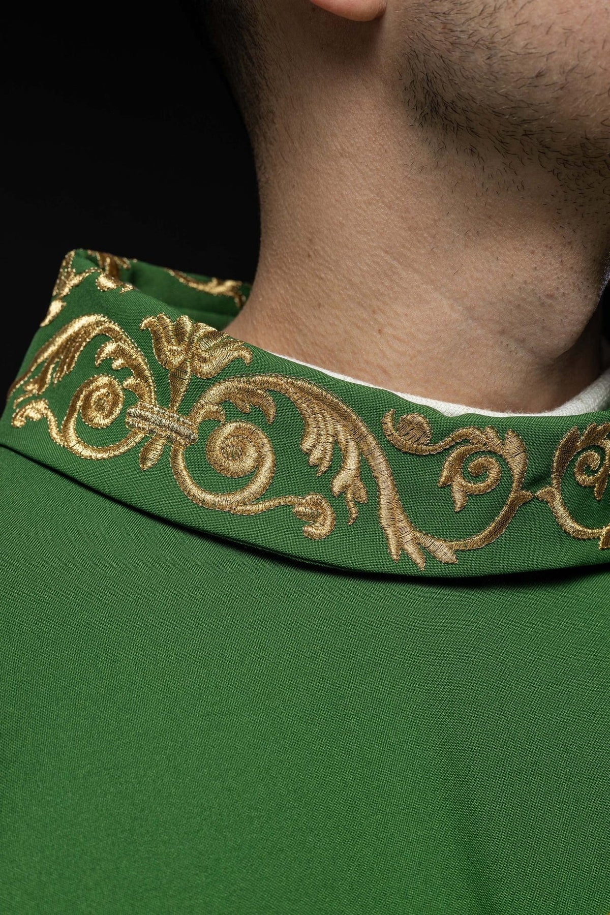 Green chasuble detail showing gold trim and ornate embroidery