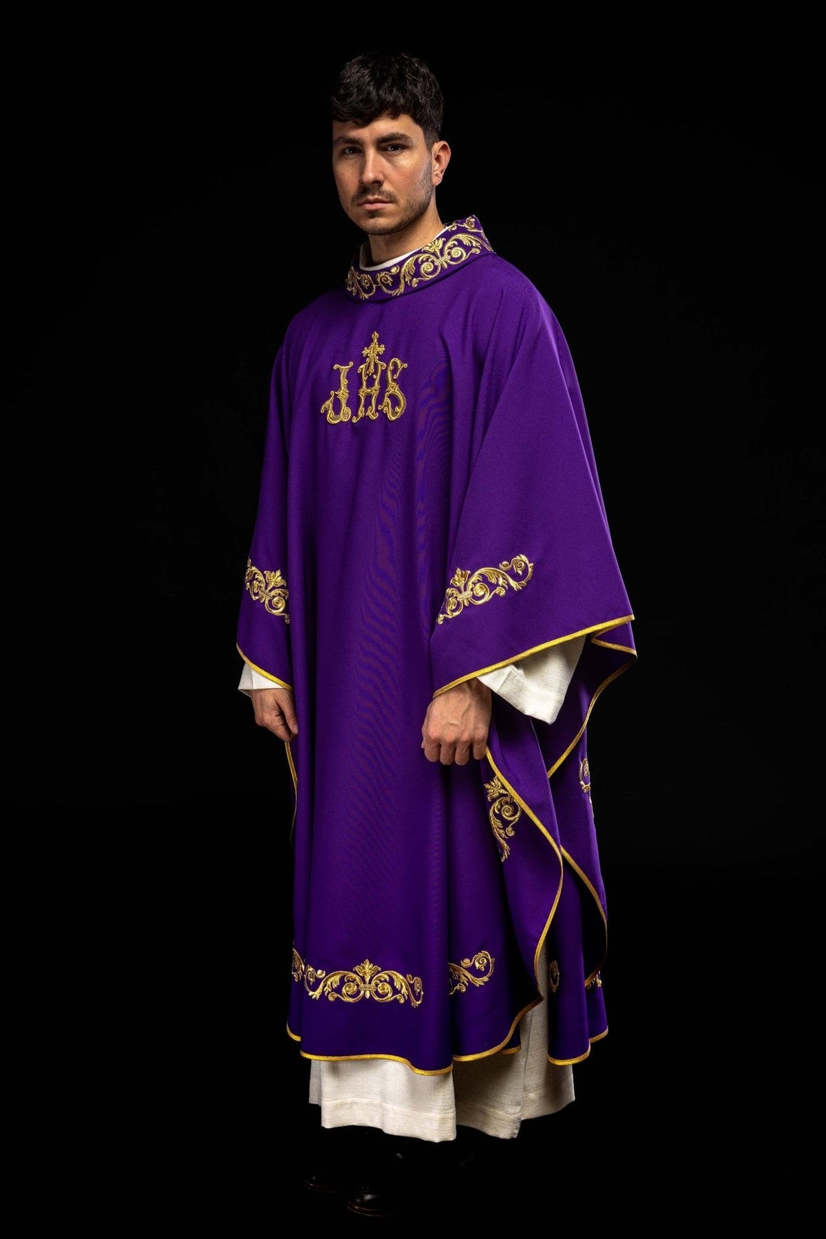 Purple chasuble, three-quarter view with gold IHS embroidery and decorative trim