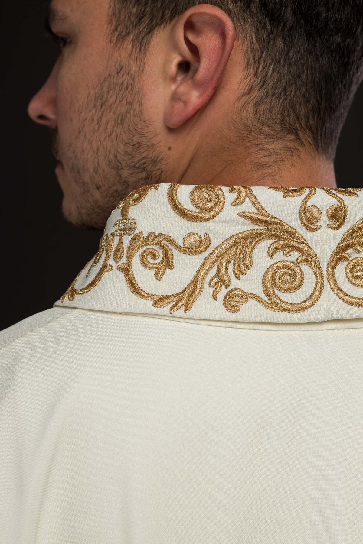 Ivory chasuble close-up of ornate gold embroidery on the stand-up collar