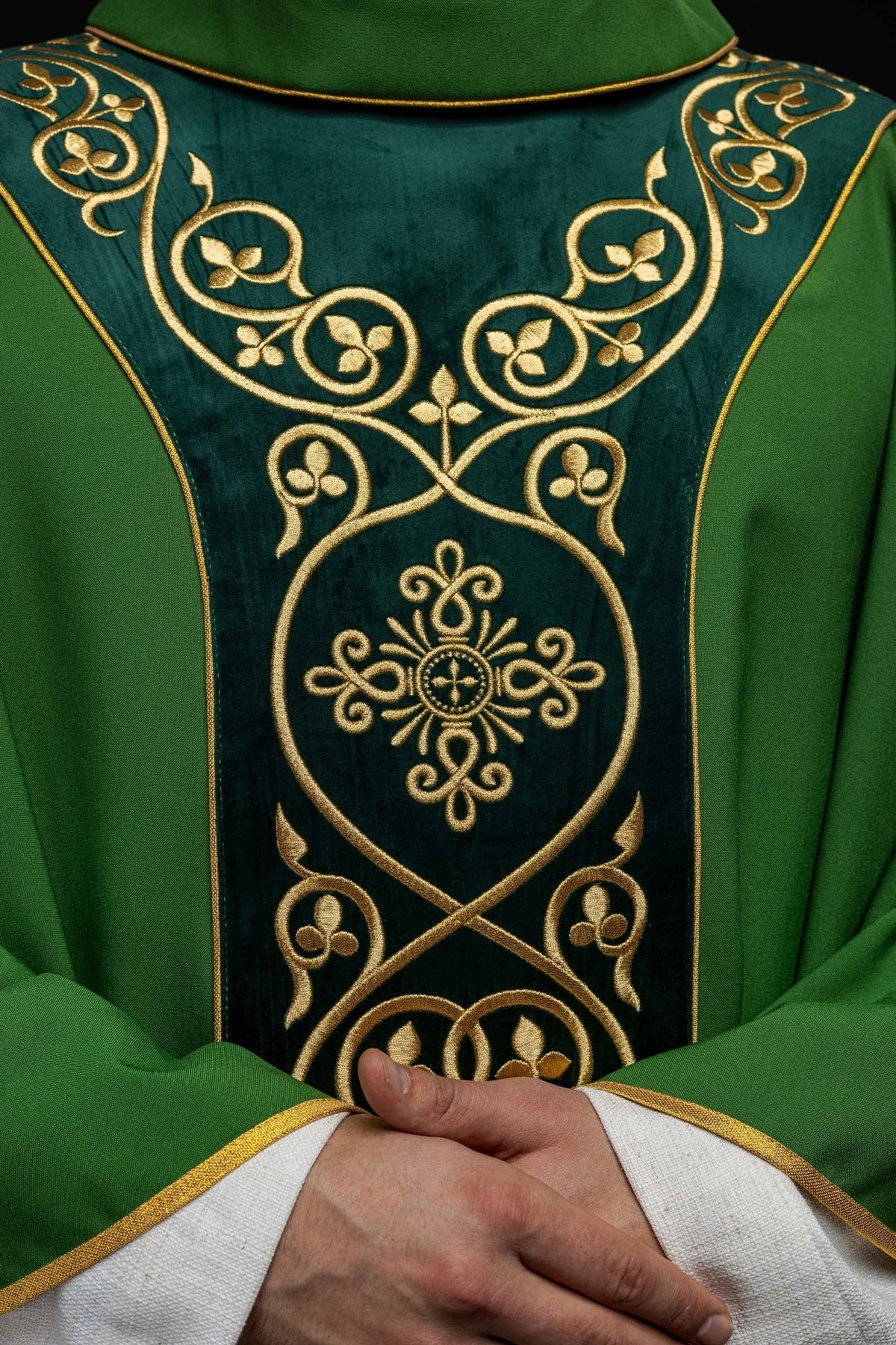 Green chasuble, close-up of gold floral embroidery on velvet orphrey