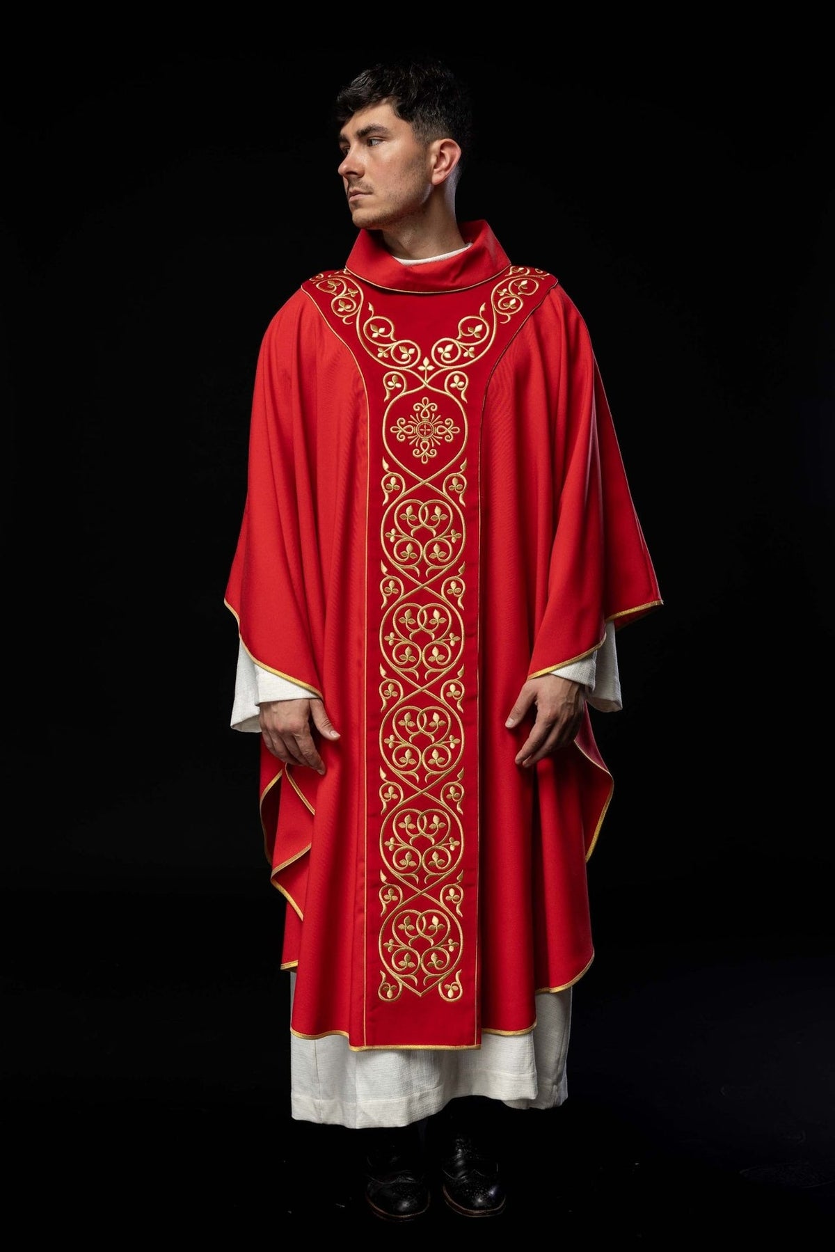 Red chasuble back view showing gold embroidery and trim