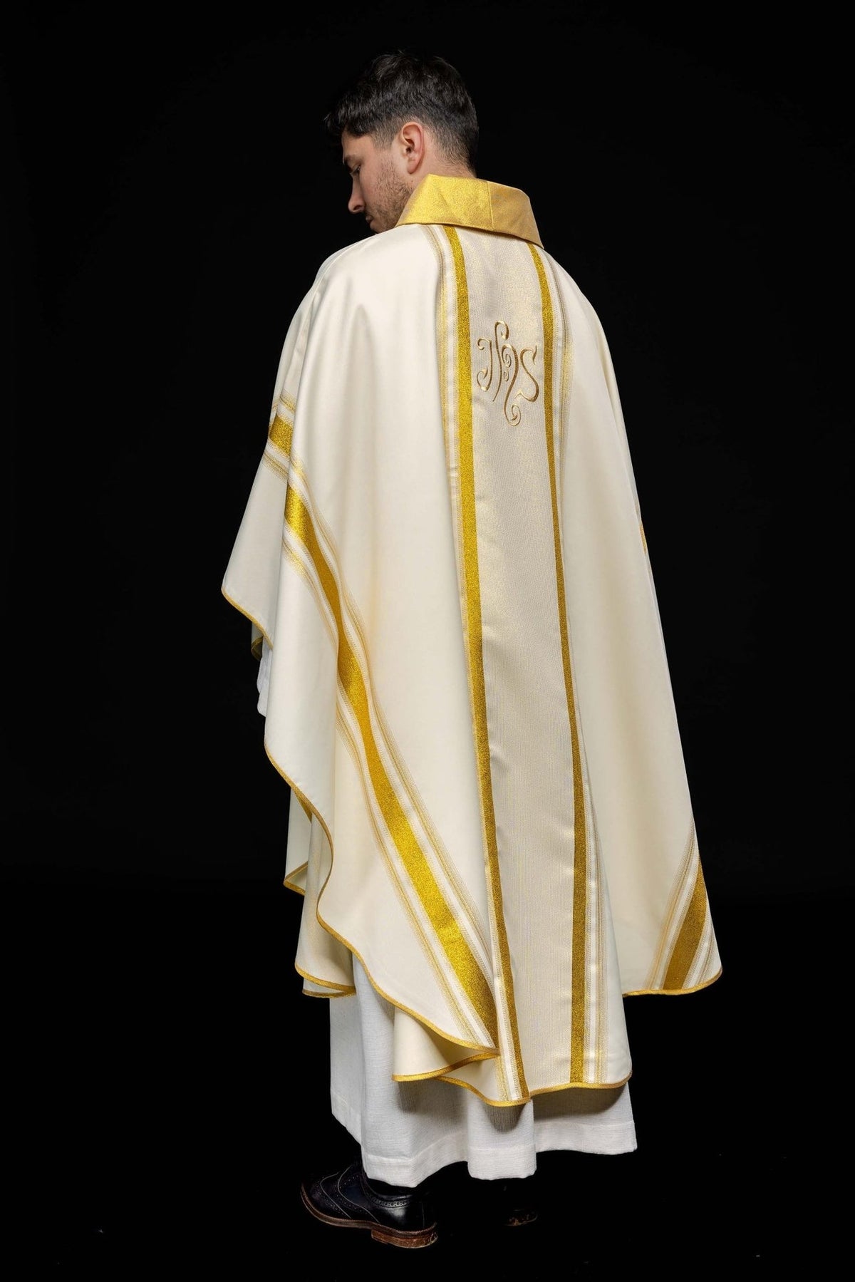 Chasuble back worn view with ivory fabric, gold trim and IHS embroidery