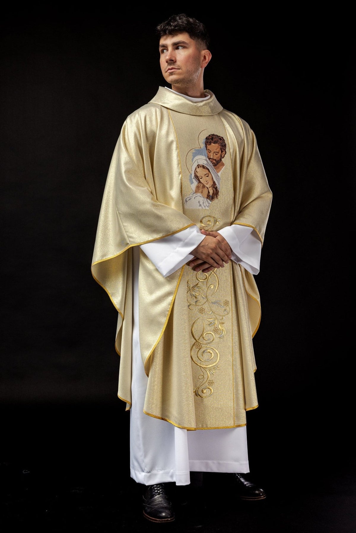 Gold chasuble worn front view with embroidered Holy Family and floral scrollwork