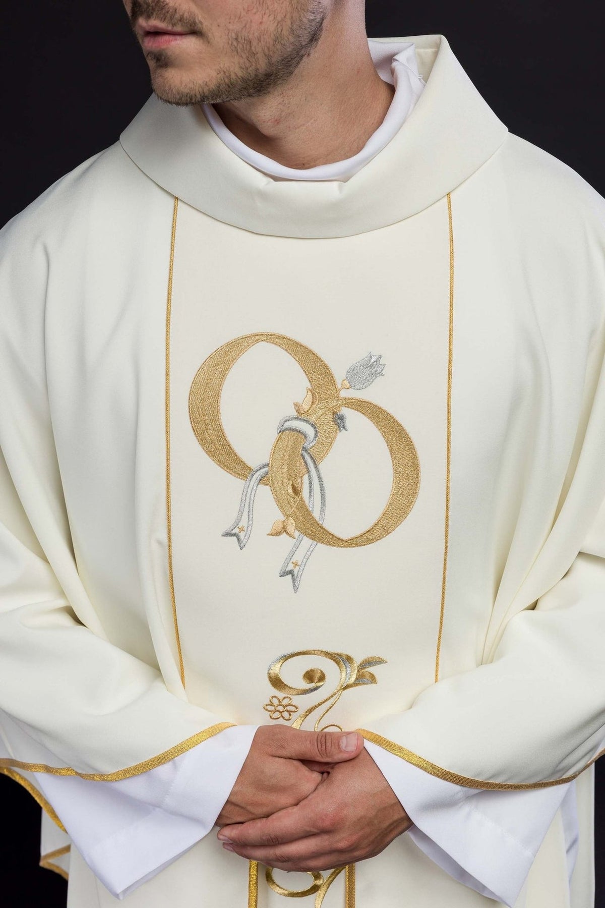Ecru wedding chasuble close-up showing stand-up collar and embroidered gold wedding rings