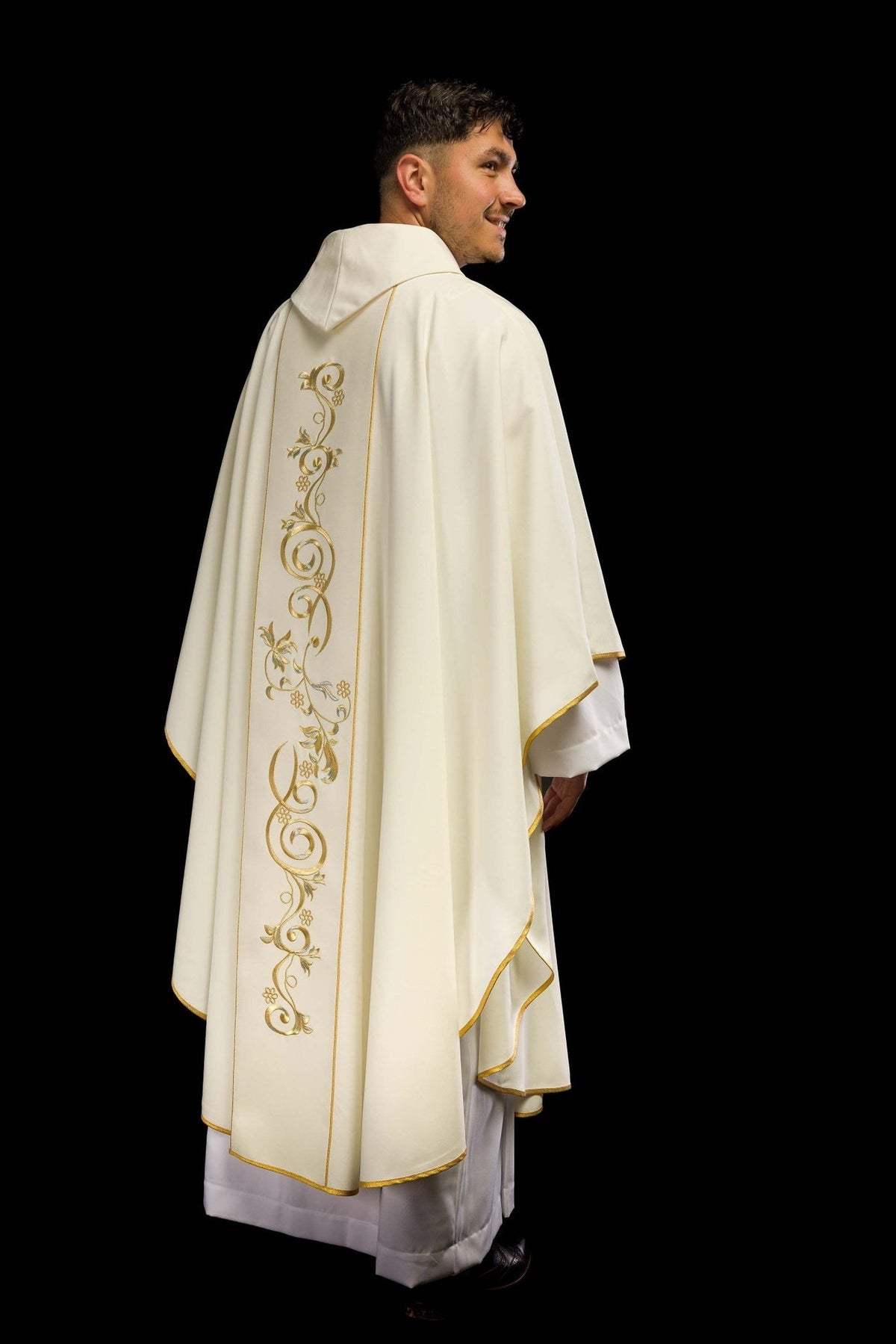 Ecru wedding chasuble rear three-quarter view with embroidered gold orphrey and trim