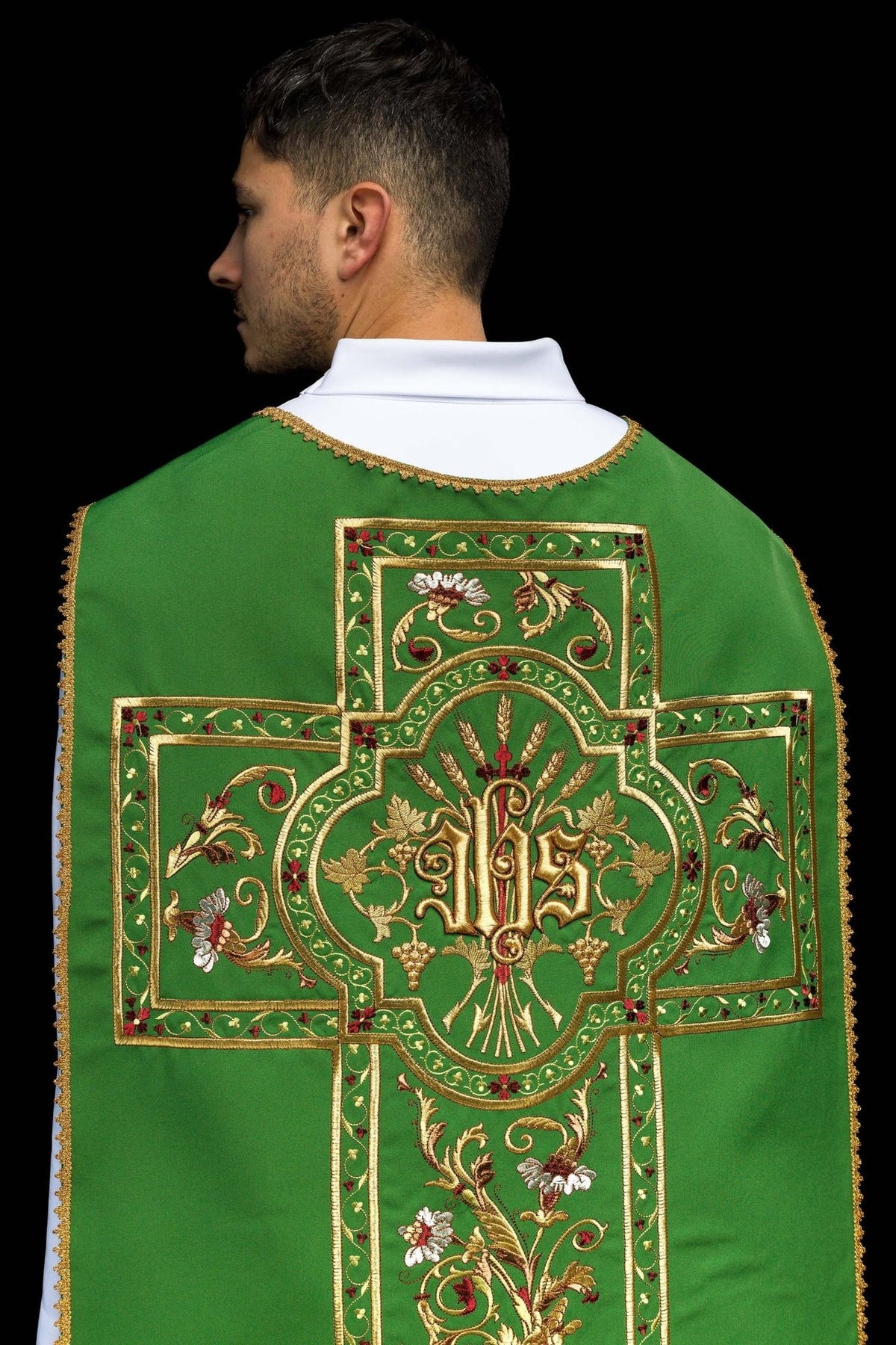 Green Roman chasuble close-up of embroidered IHS motif and gold trim