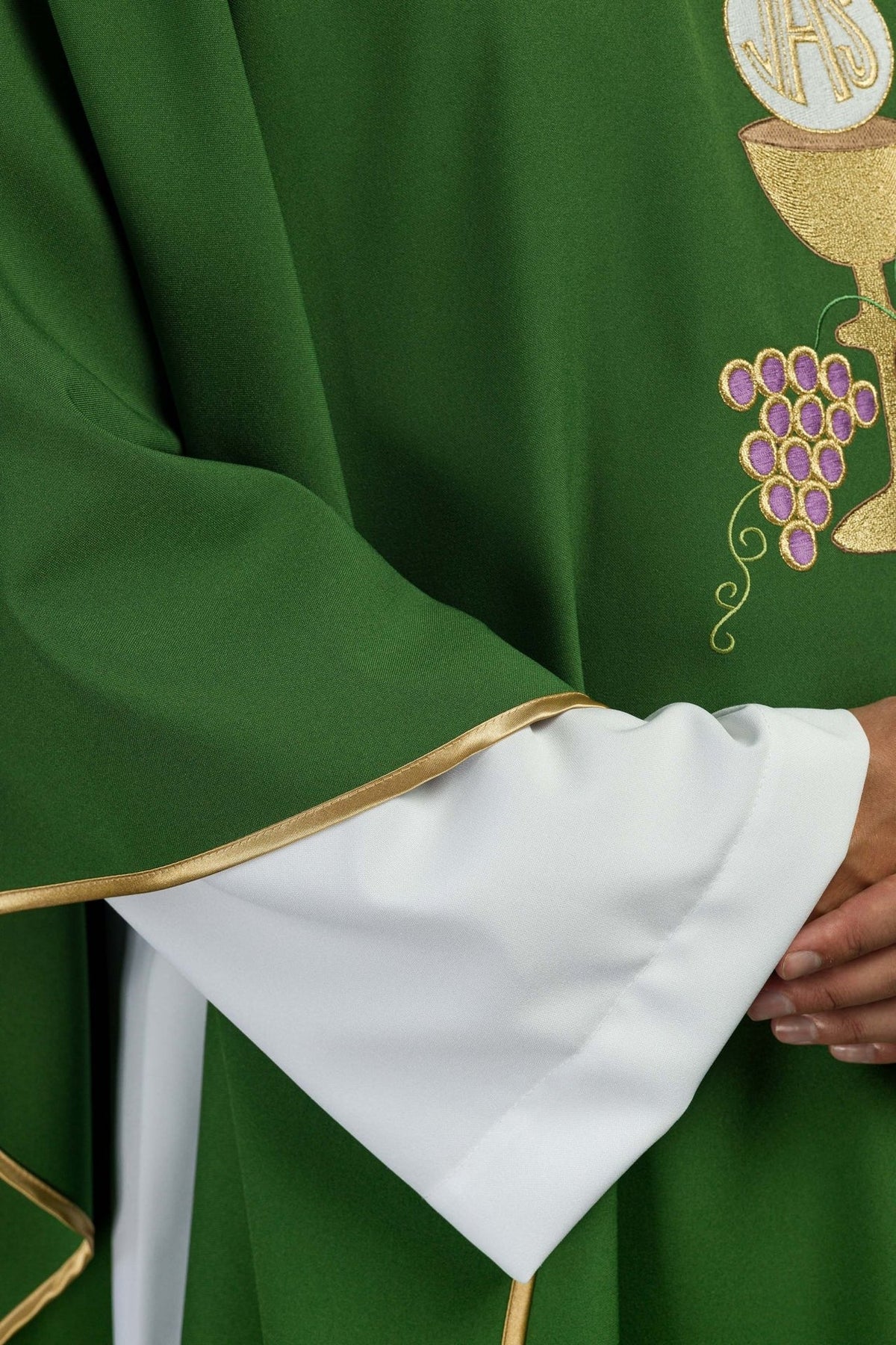 Green chasuble detail showing gold trim on the sleeve edge