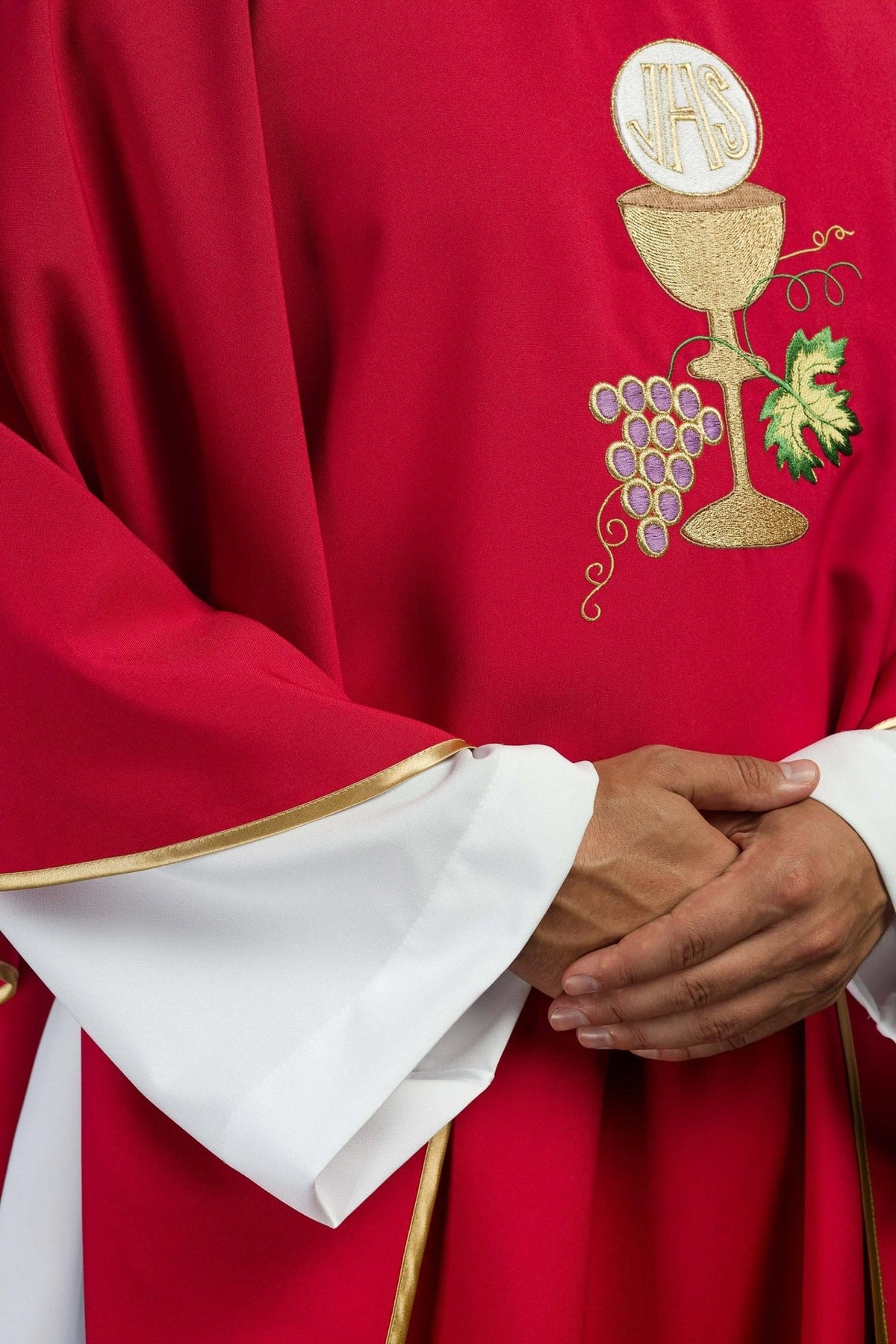 Red chasuble, close-up of chalice, cross and grapes embroidery