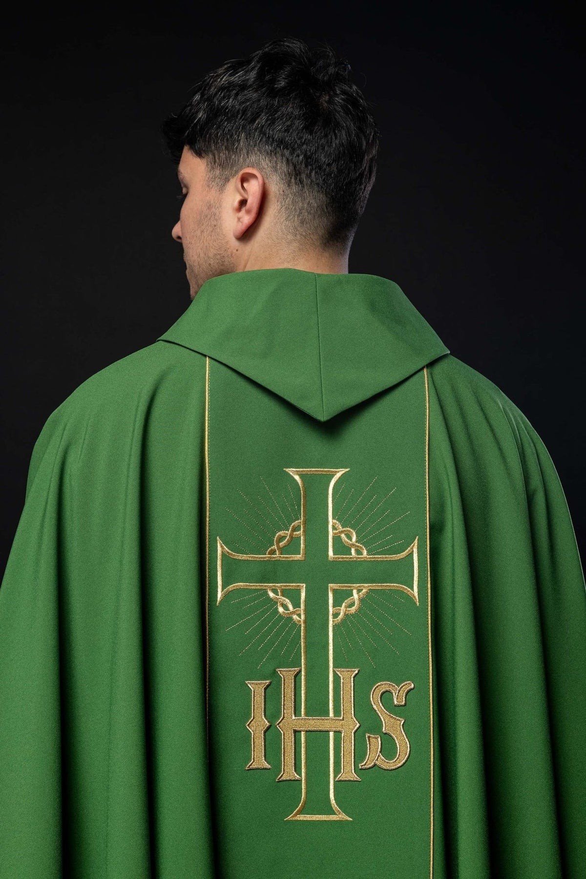 Green chasuble back view showing gold cross and IHS embroidery