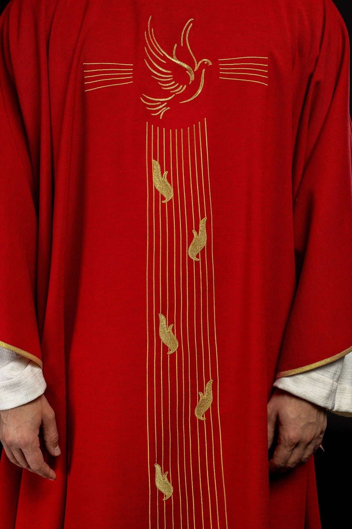 Red chasuble front detail with gold Holy Spirit embroidery and vertical lines
