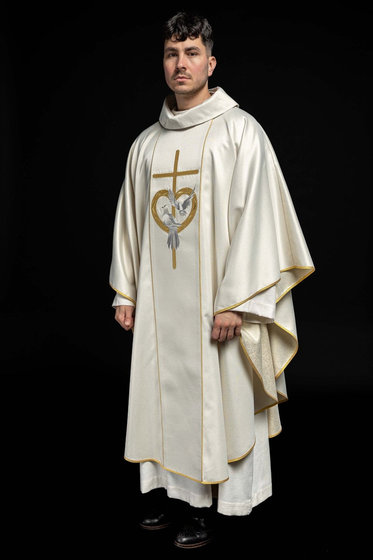 Wedding chasuble worn, full front view with gold trim and embroidered doves