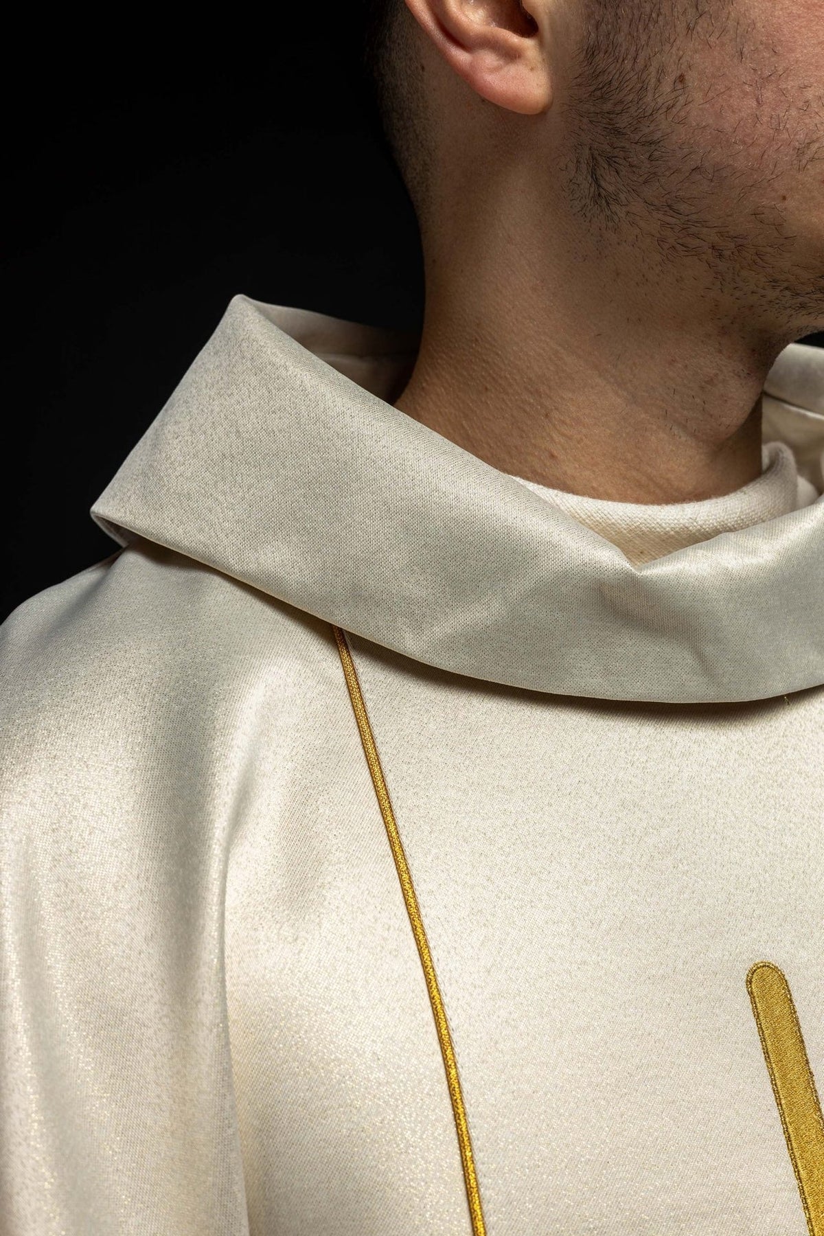 Wedding chasuble close-up showing ecru stand-up collar and gold trim
