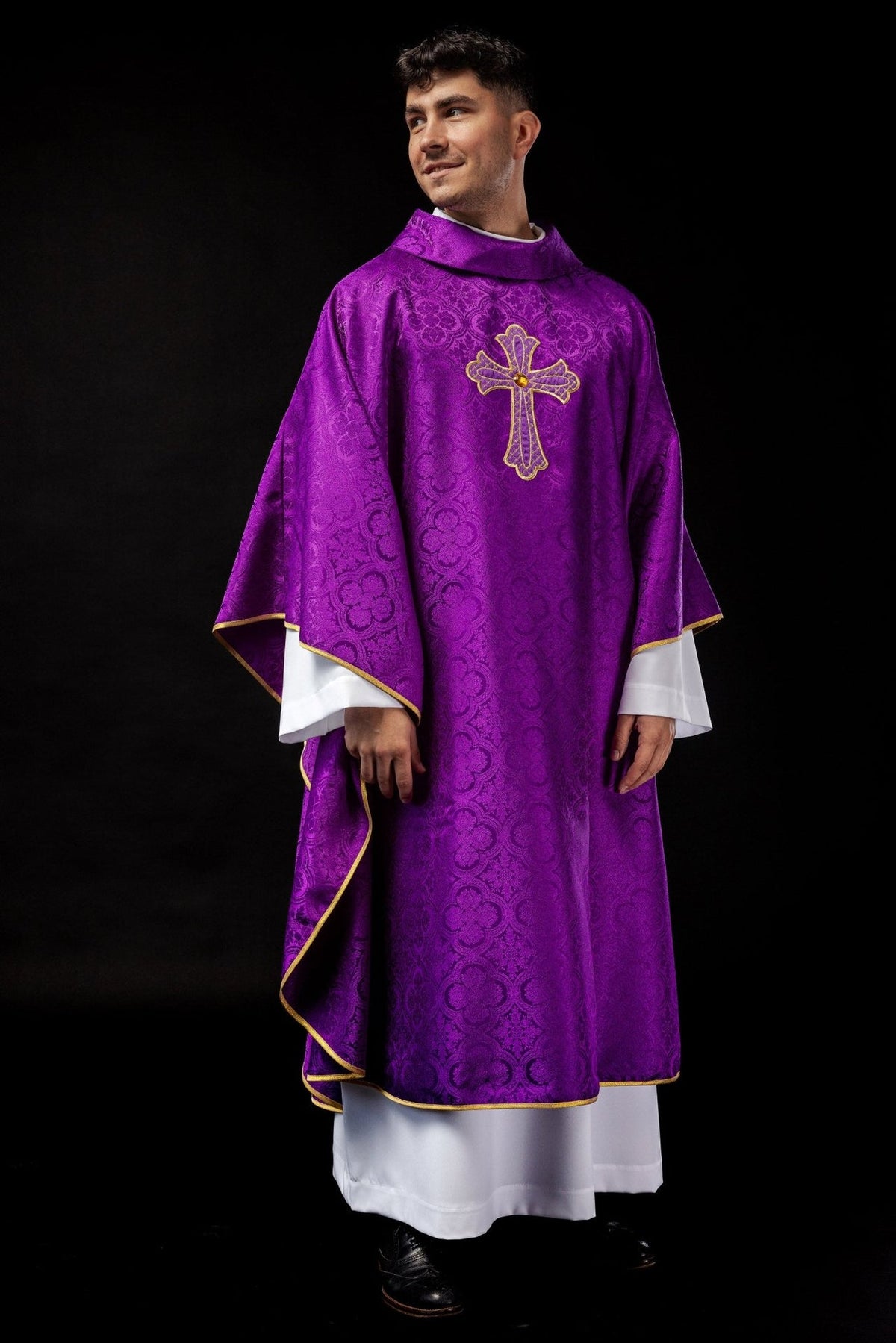 Purple chasuble front view with gold trim and cross embroidery