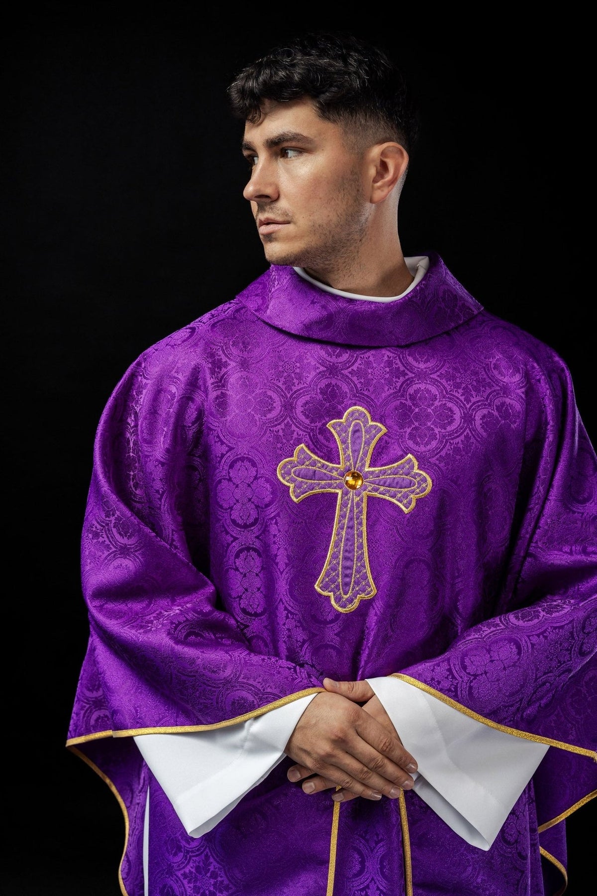 Purple chasuble front view with stand-up collar and ornate cross embroidery