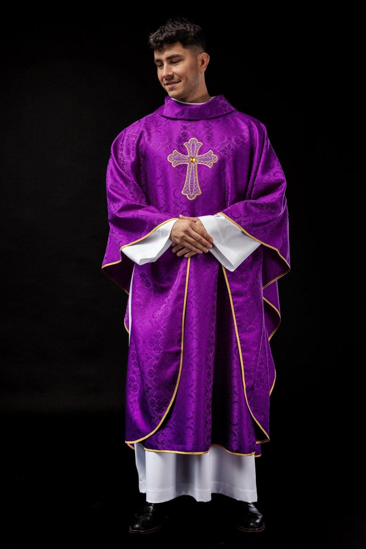 Purple chasuble worn front view with gold trim and cross embroidery