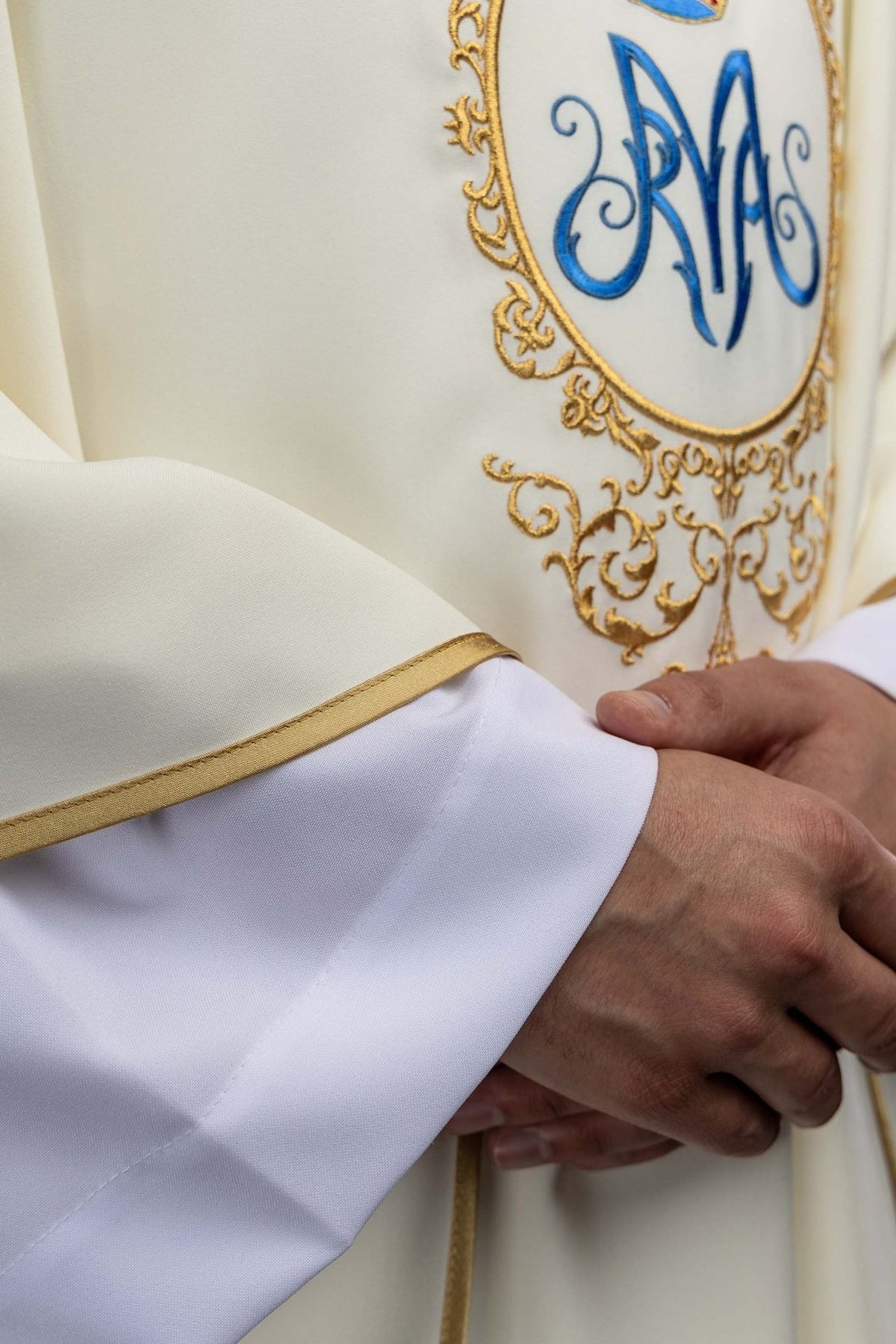 Marian chasuble close-up showing gold trim on the sleeve