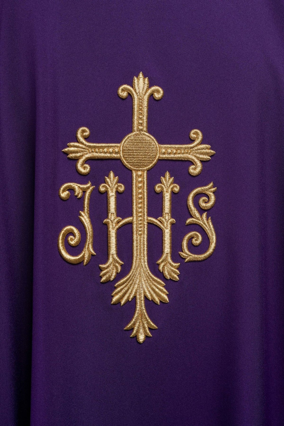 Purple chasuble close-up of gold Cross and IHS embroidery