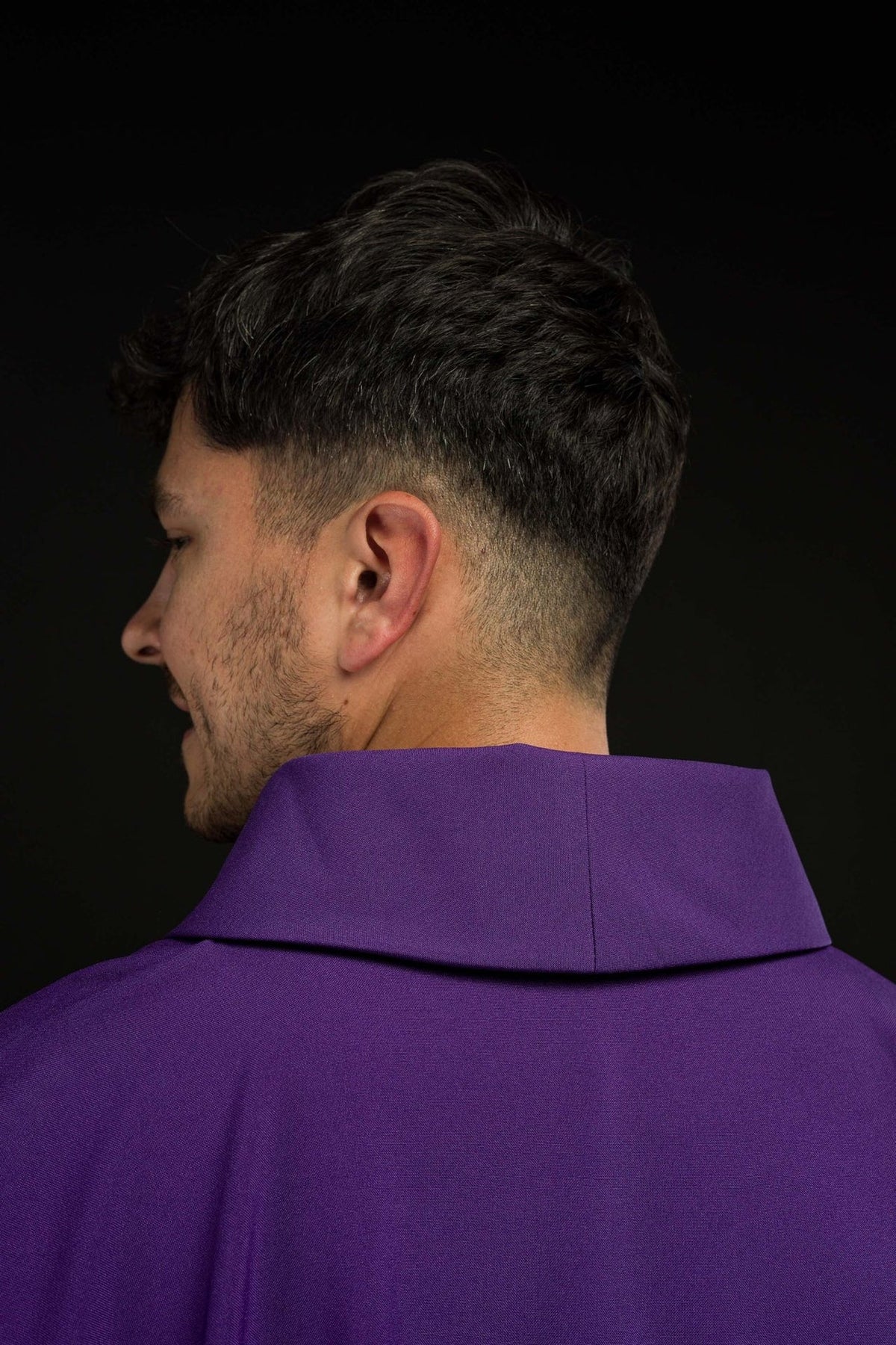 Purple chasuble back close-up with plain fabric and stand-up collar