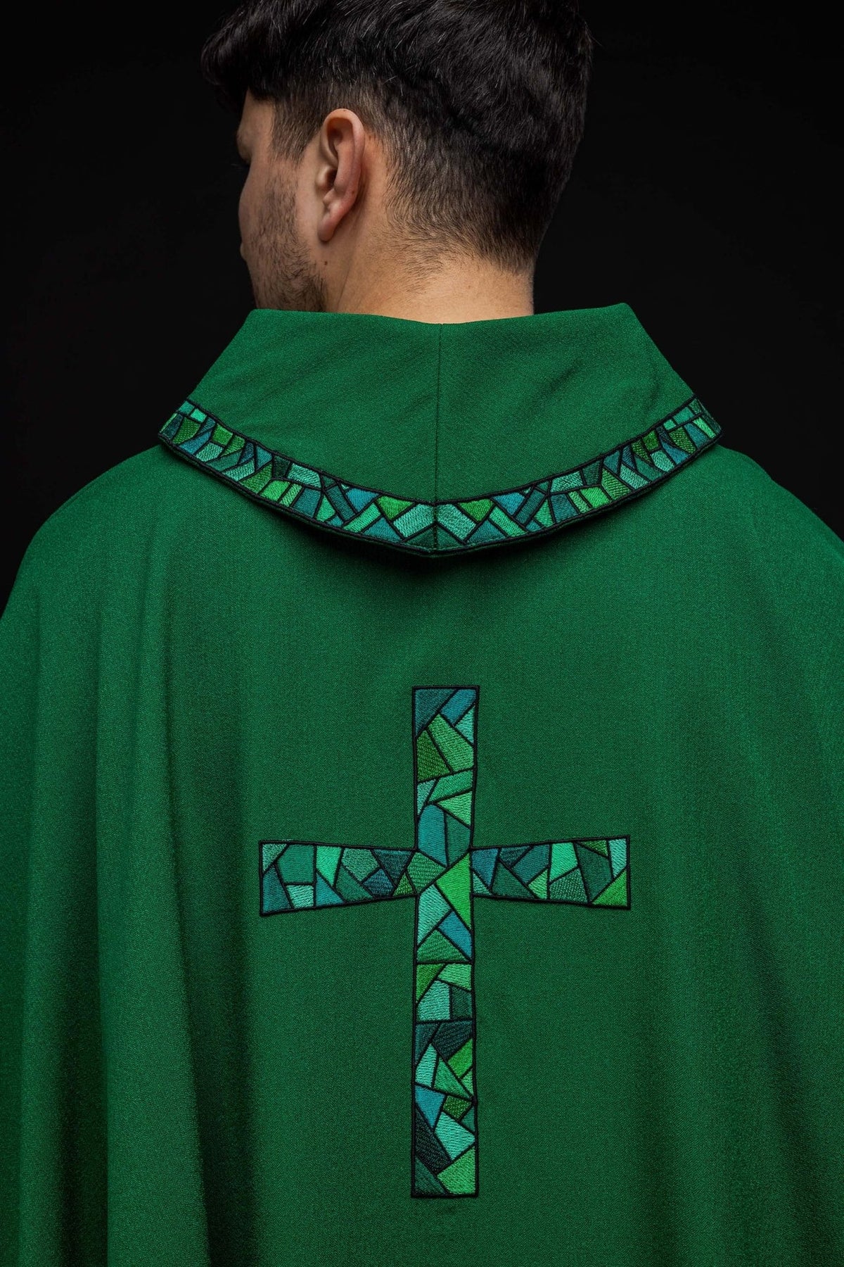 Green chasuble back view with mosaic cross and embroidered collar trim