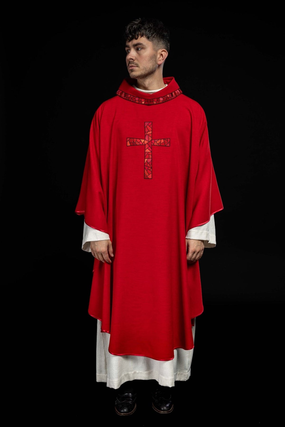 Red chasuble front view with embroidered mosaic cross and patterned trim