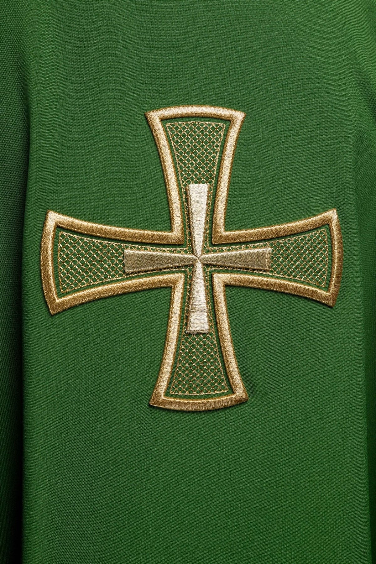 Green chasuble close-up showing gold cross embroidery