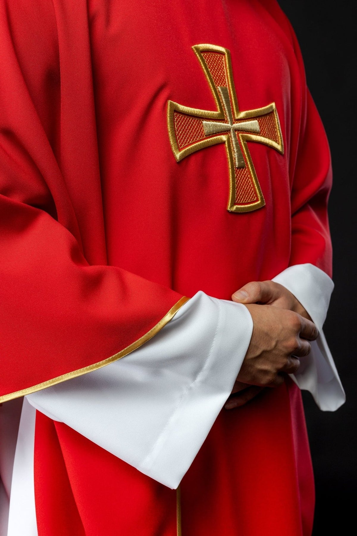 Red chasuble side close-up with gold cross embroidery and gold trim