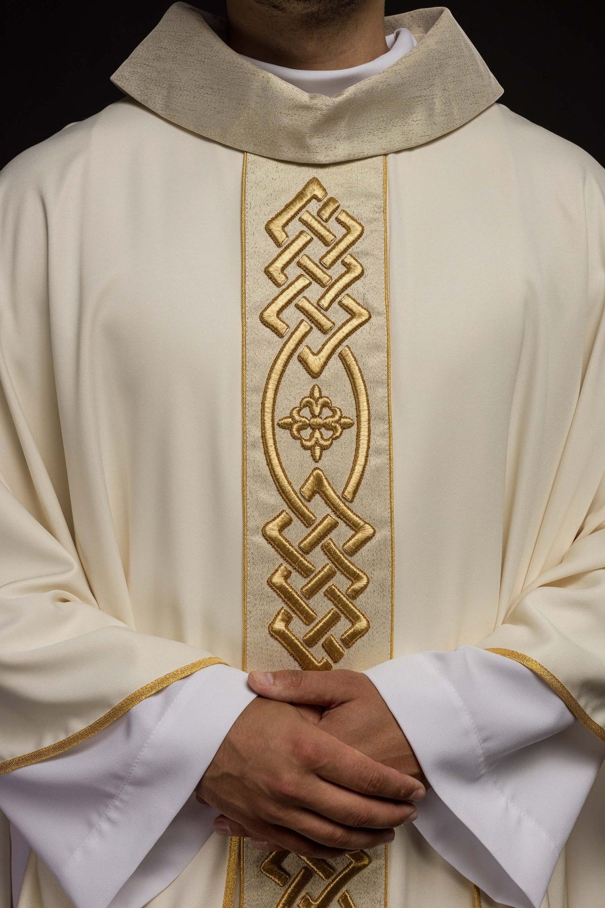 Ecru chasuble close-up showing stand-up collar and gold embroidered trim