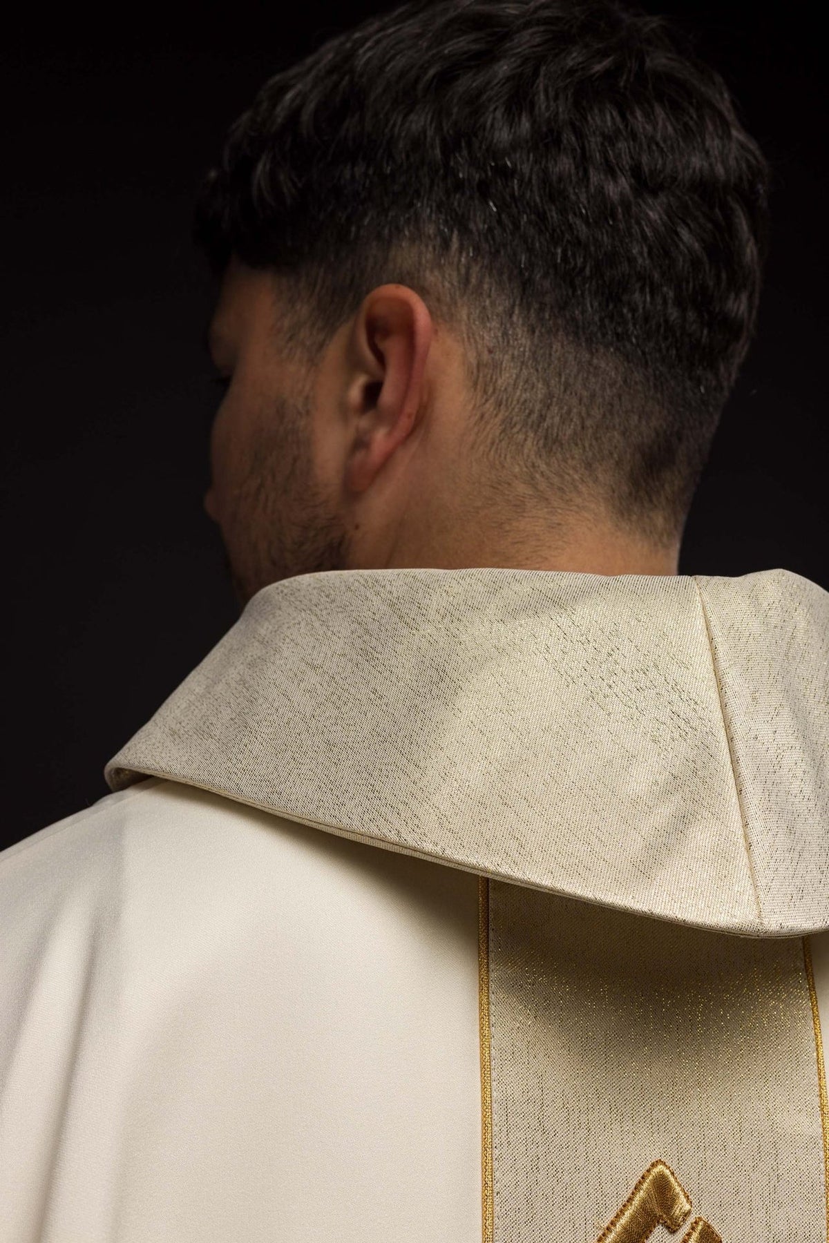 Ecru chasuble back close-up showing stand-up collar and central trim