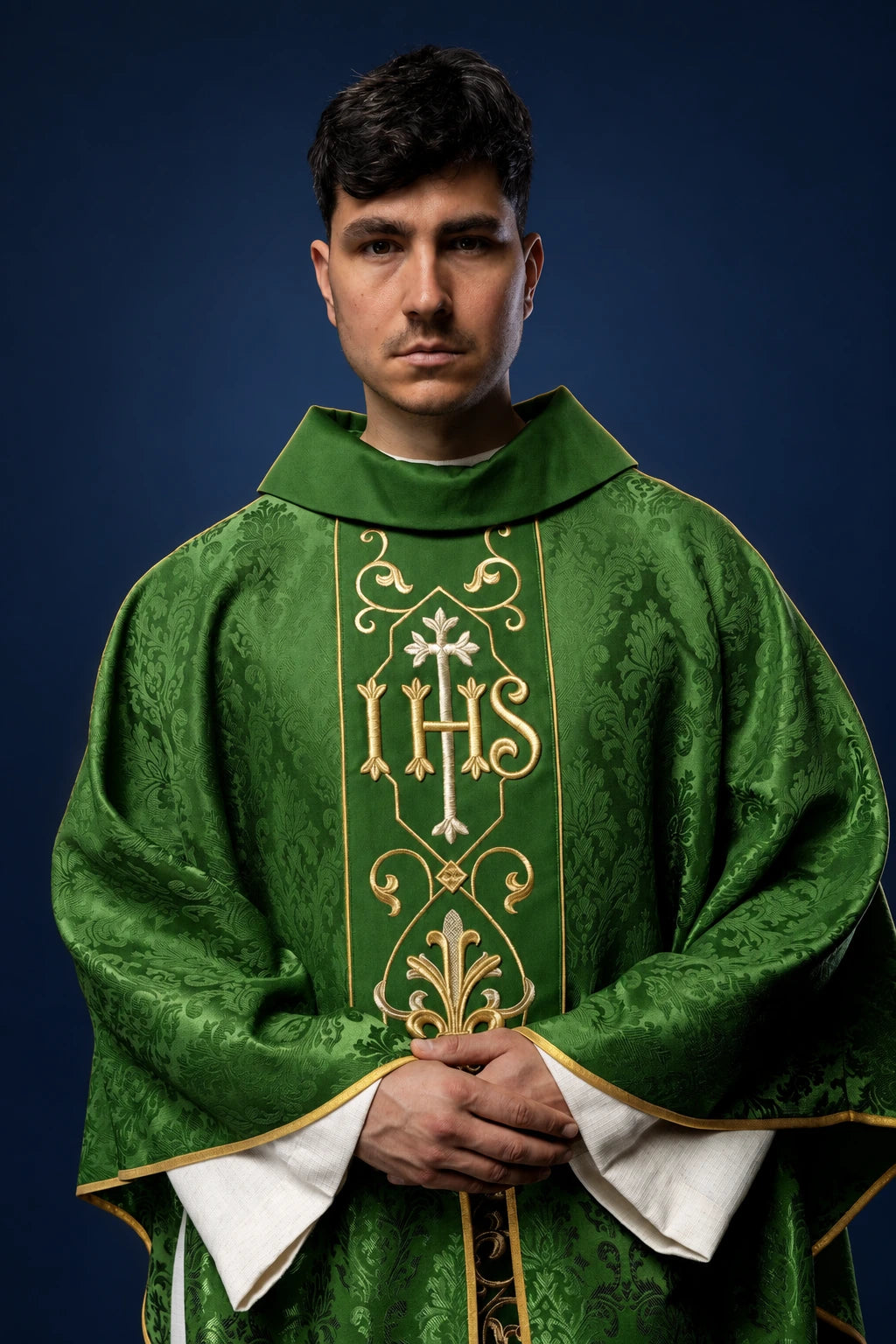 Green Embroidered Catholic Chasuble with IHS, front view worn with gold trim and stand-up collar
