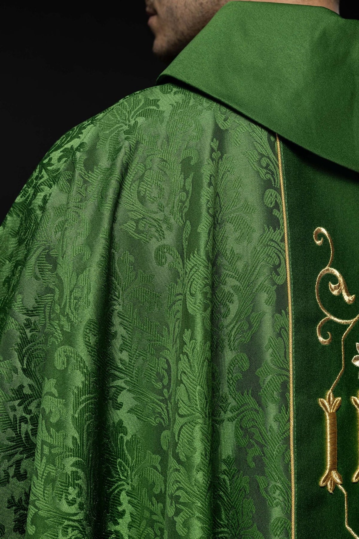 Green chasuble close-up of repeated fleur-de-lis embroidery and orphrey