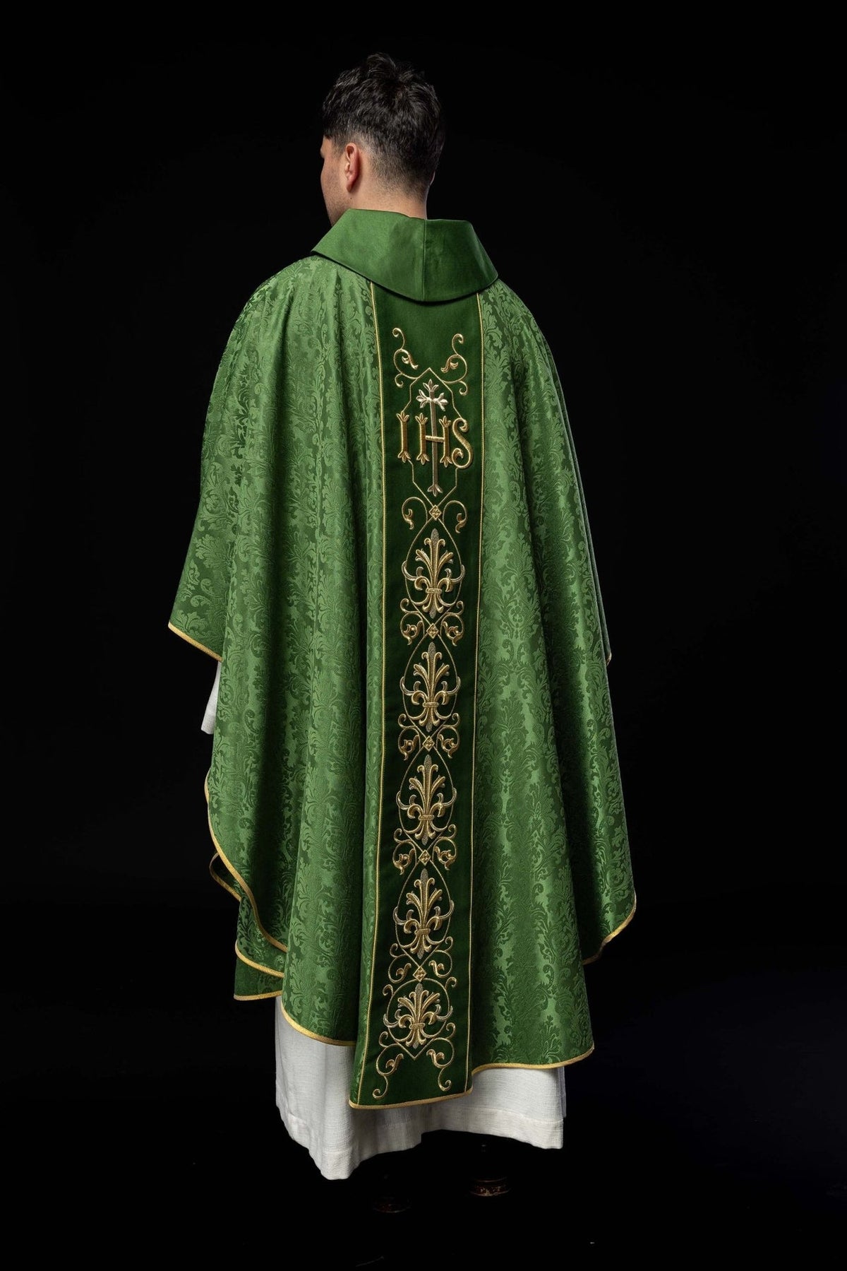 Green chasuble back view with embroidered IHS orphrey and floral fabric
