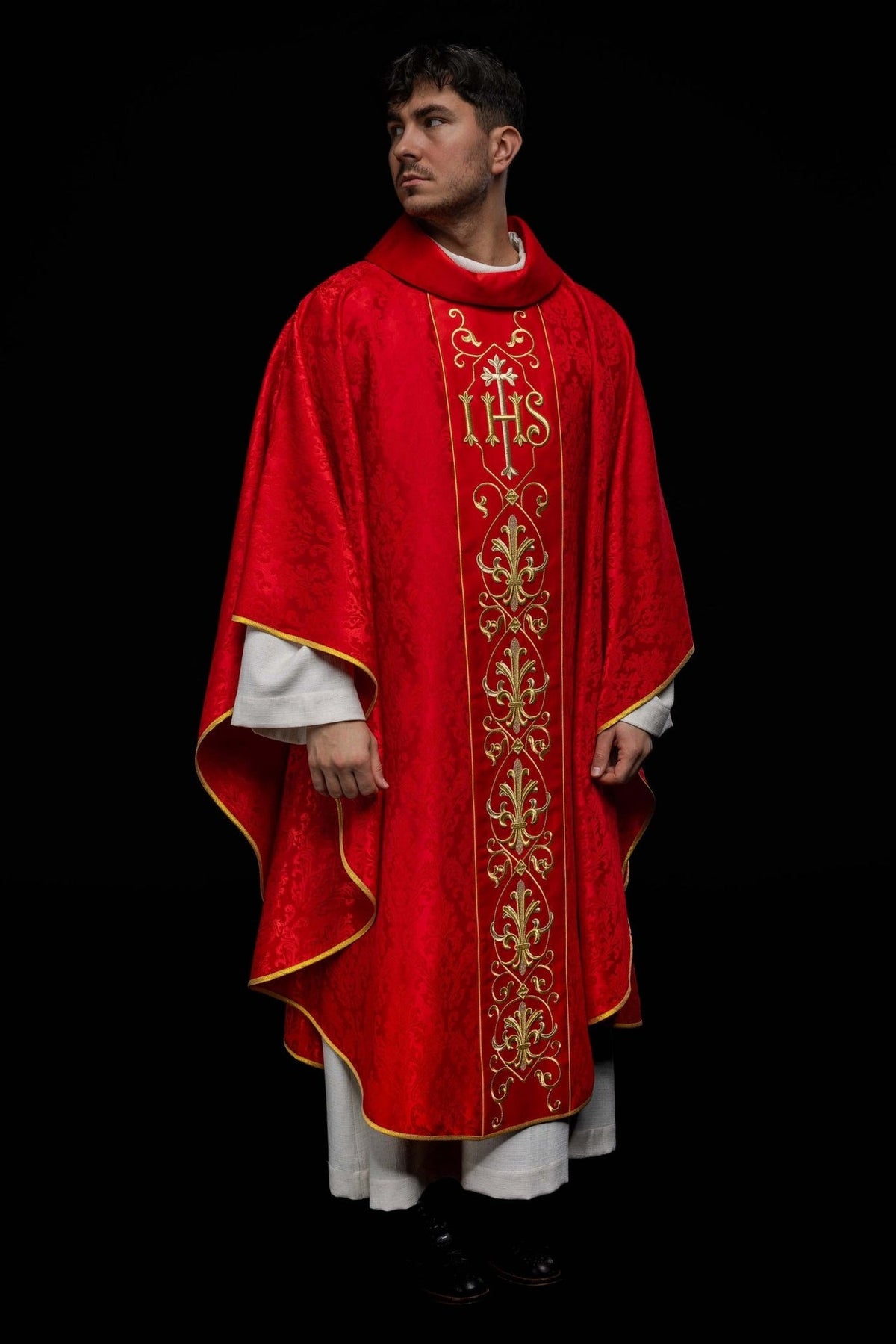Red chasuble, full front view with IHS embroidery and gold trim